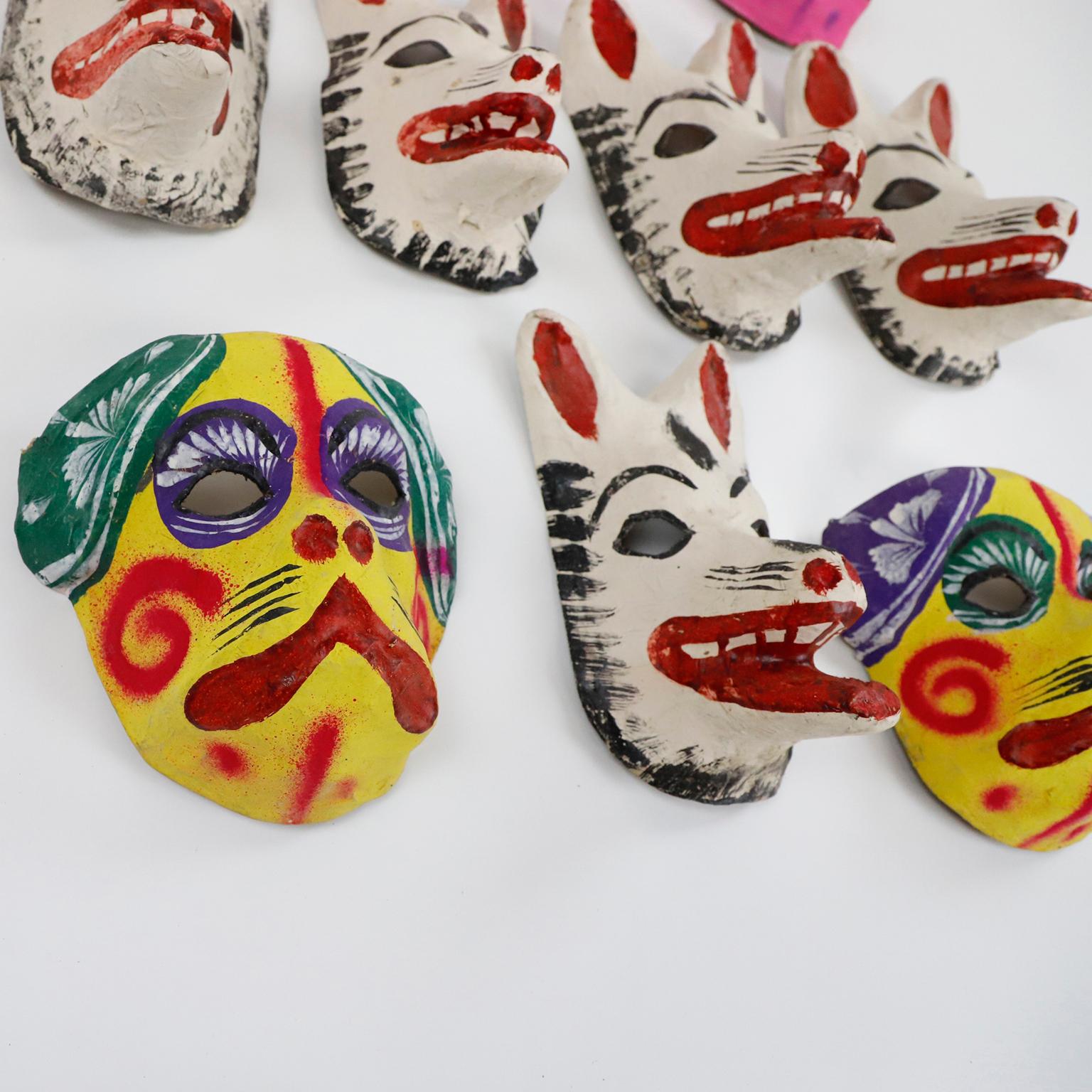 Circa 1960. We offer this antique set of 10 Mexican papier-mâché masks 100% handmade and paited with anilina (natural pigments).