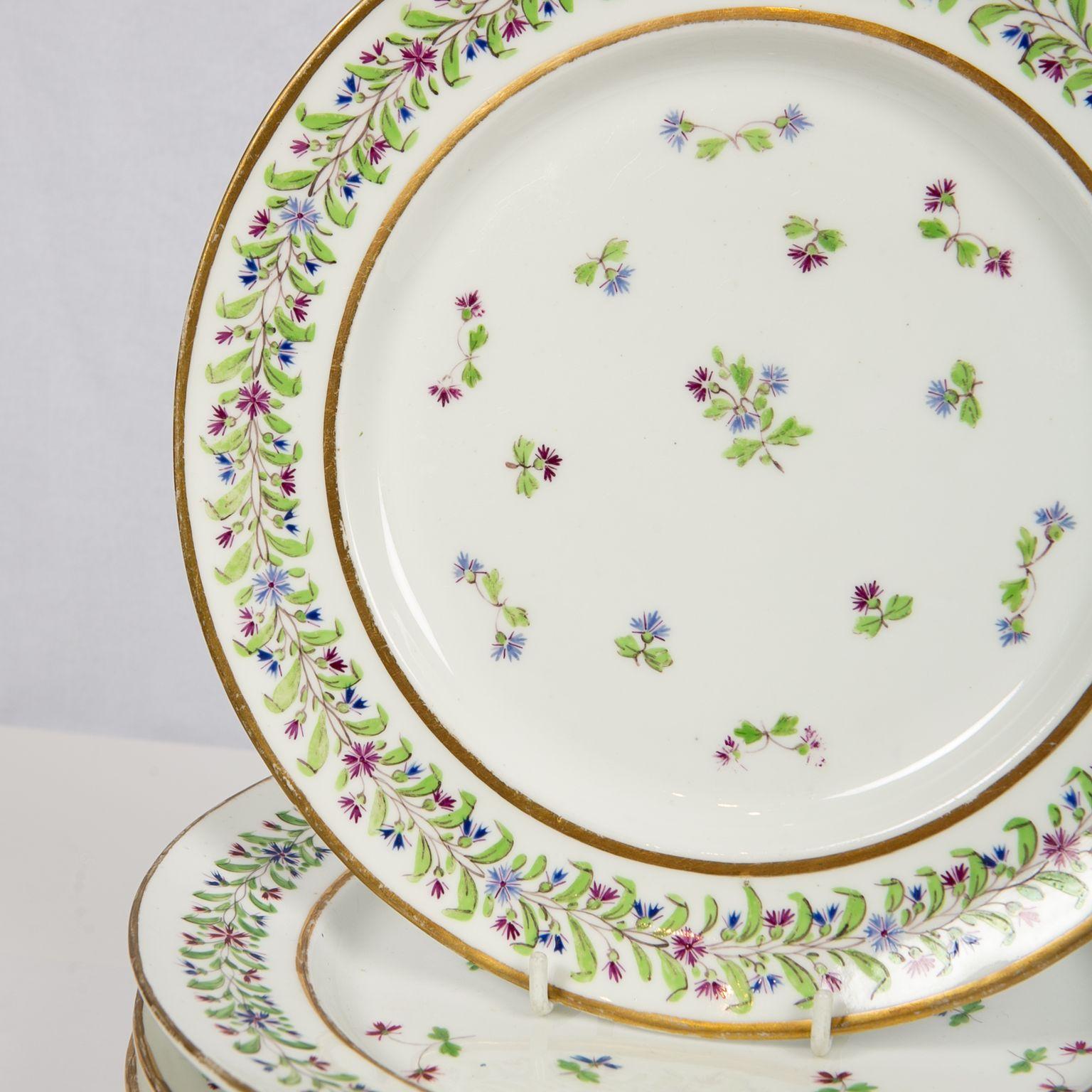 We are pleased to offer this set of twelve lovely antique porcelain dishes decorated in the 