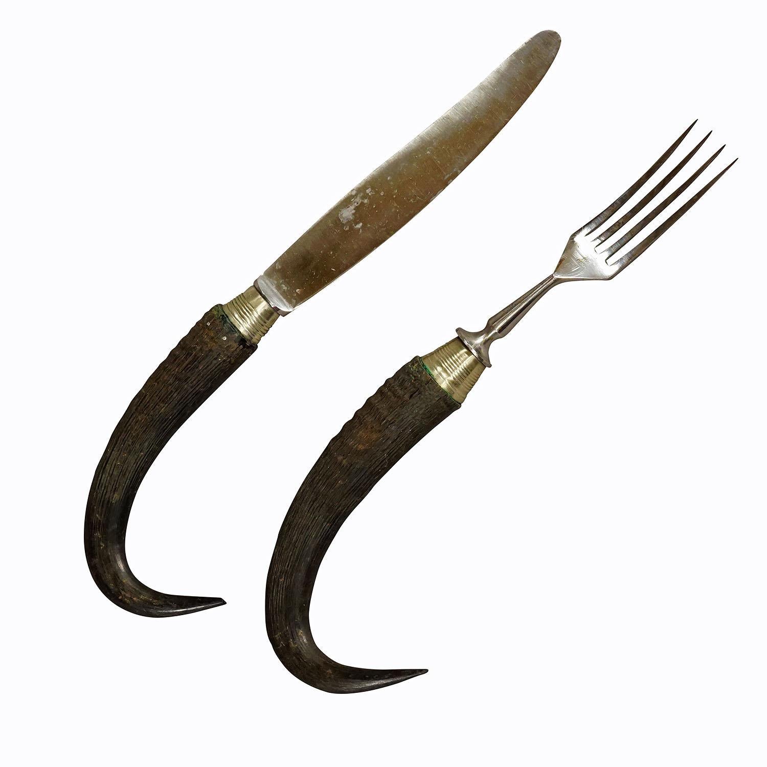 Antique set of rustic hunters cutlery with Chamois Horn Handles

A rare antique set of knife and fork. The handles are made of genuine chamois horn. Tines and blade are made of galvanized metal. Manufactured in Germany around 1900. This type of