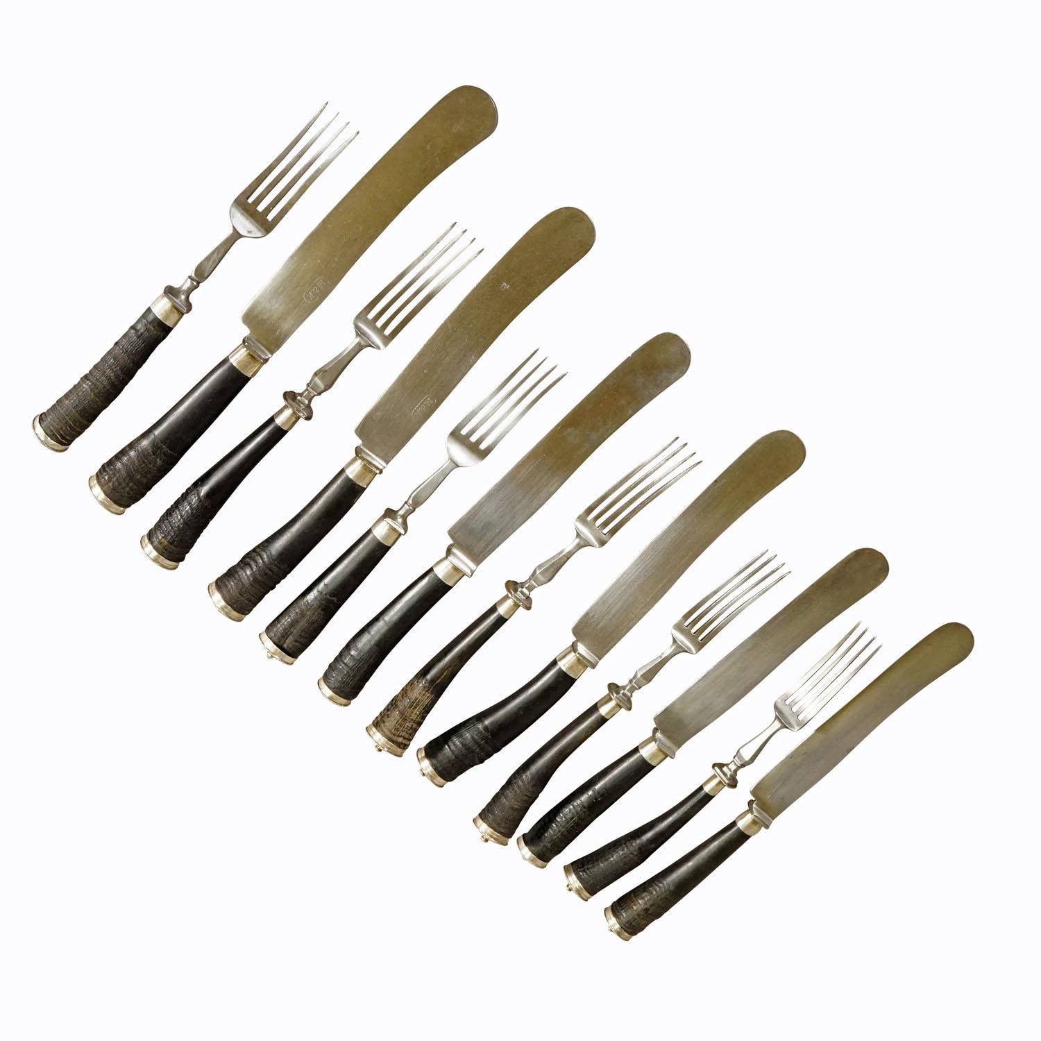 Antique set of rustic hunters cutlery with chamois horn handles

A rustic set of six knives and forks. The handles are made of genuine chamois horn and feature a decorated silver knob on their ends. The blades are made of galvanized metal.