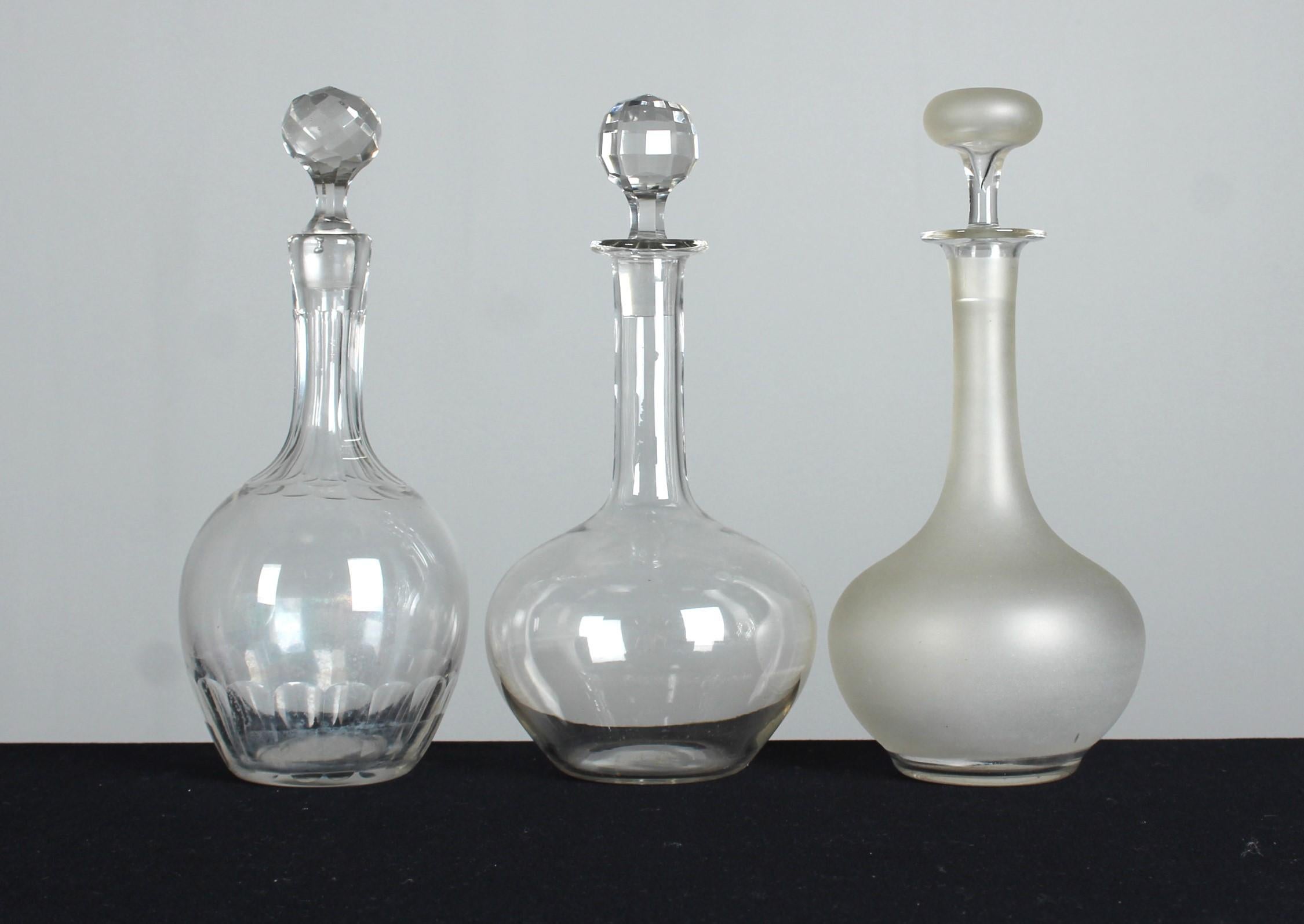 A beautiful, unique set of three antique carafes, France, 20th century.

In France at the beginning of the 20th century carafes experienced a highlight of elegance and sophistication. This period, often known as the Belle Époque, was characterized