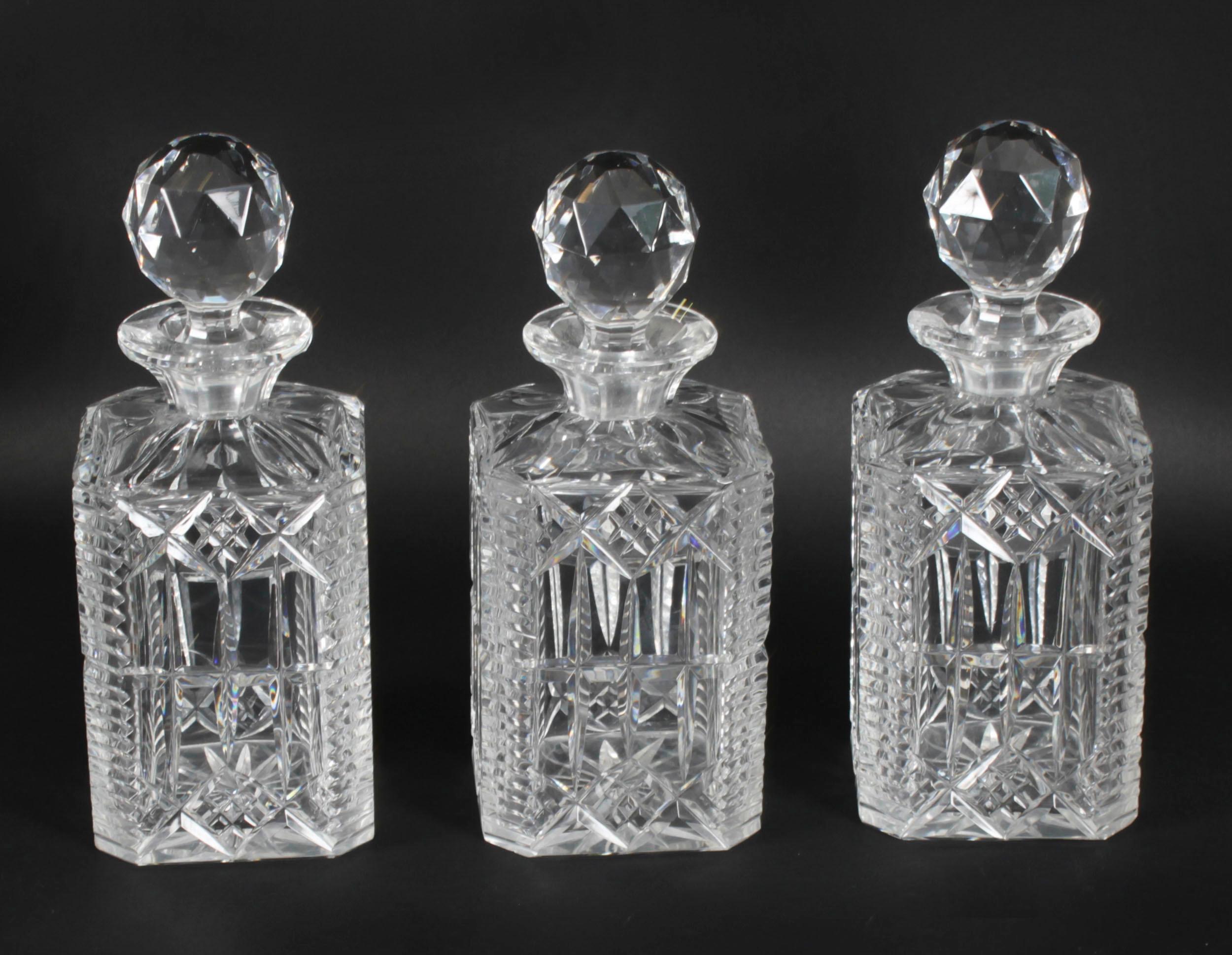 A superb set of three antique cut crystal decanters circa 1920 in date. 

The vintage hobnail-cut crystal square decanters with faceted stoppers, with hexagon shaped panelled deep star cut bodies with a star cut bases.

It is a decorative and also