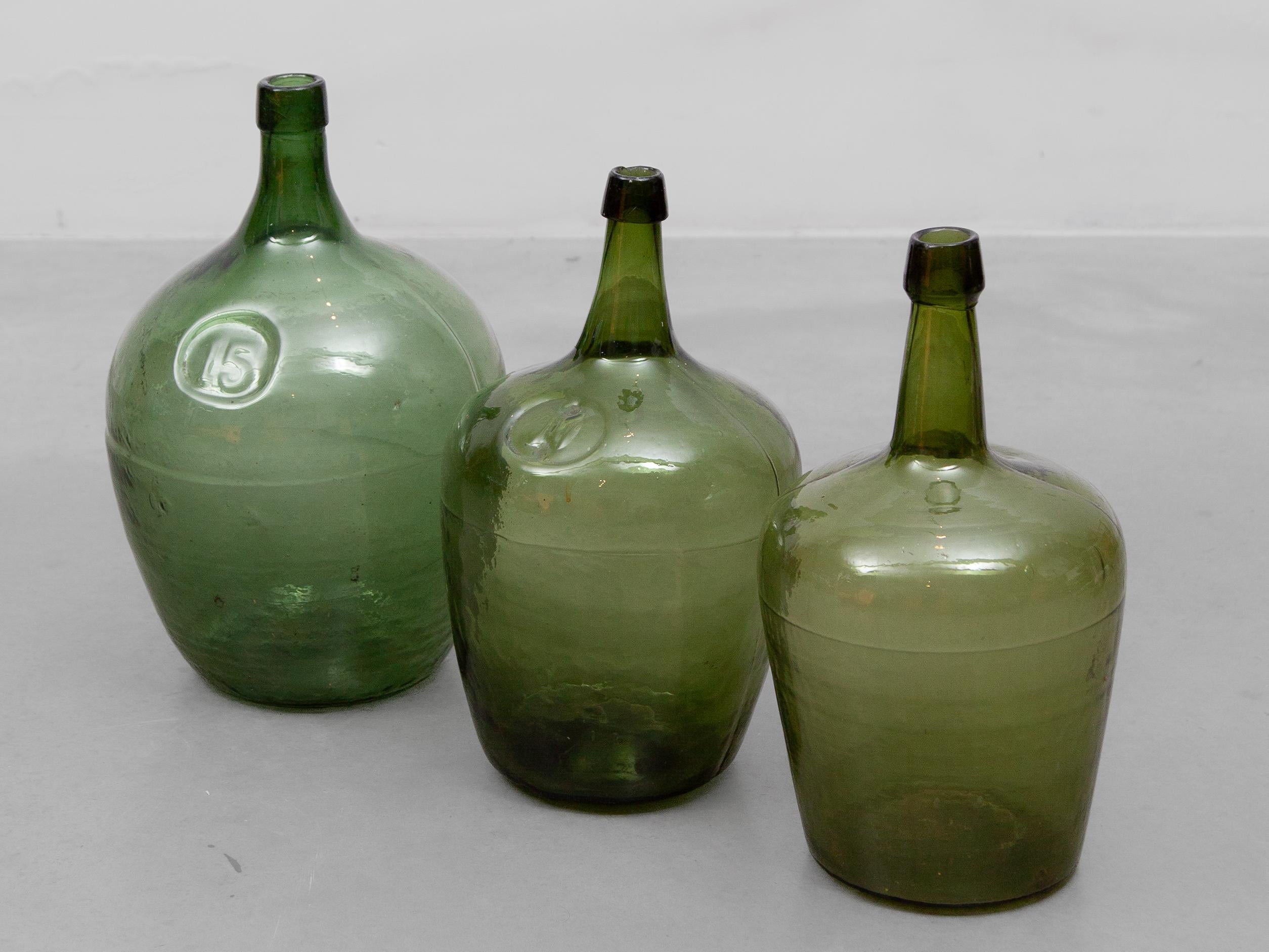 German Antique Set of Three Green Glass Demijohn Hand Blown Bottles, Mecklenburgh