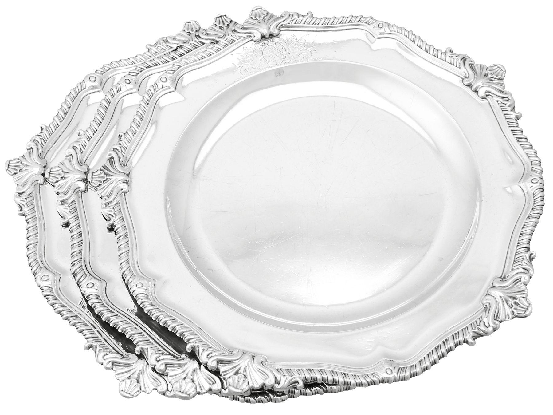 An exceptional, fine and impressive set of three antique Georgian English sterling silver dinner plates/second course dishes, an addition to our range of collectable dining silverware.

These exceptional antique George II sterling silver dinner