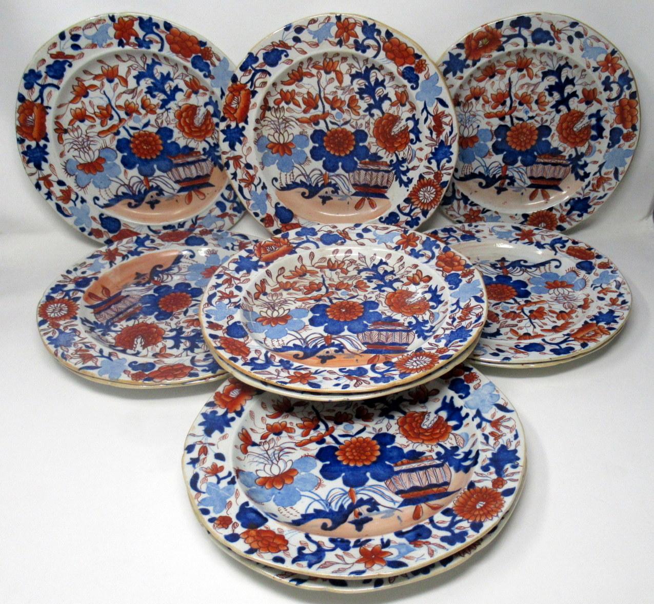 An exceptionally fine set of twelve English Masons hand painted Imari cabinet plates. First quarter of the 19th century. 

Each hand painted in the Japanese Imari palette depicting a jardinière surrounded by flowers, leaves and branches in colors