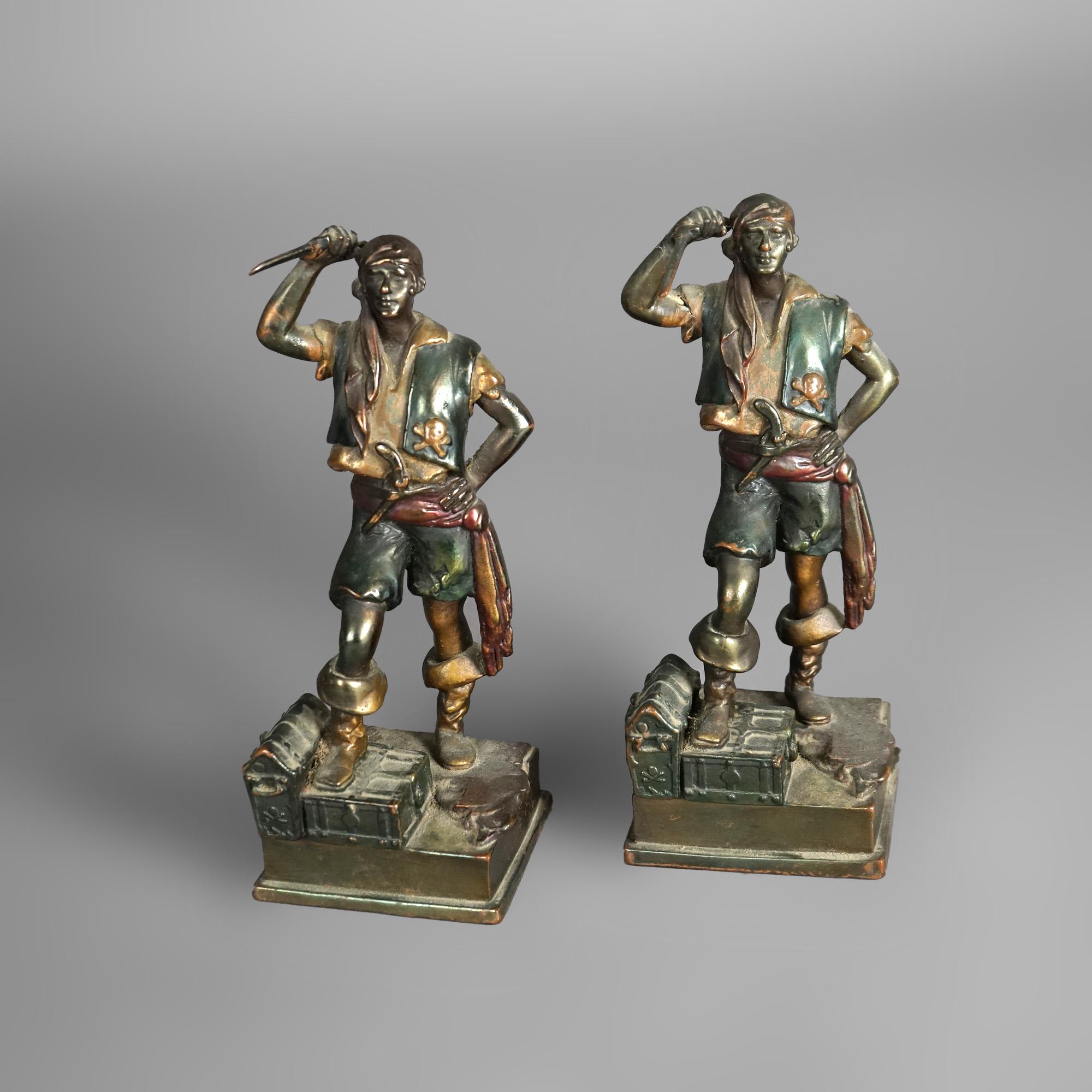 An antique pair of Pompeian figural bookends in the manner of Frankart offer polychromed cast bronze pirates with swords protecting their treasure chests, c1920

Measure - 9.25