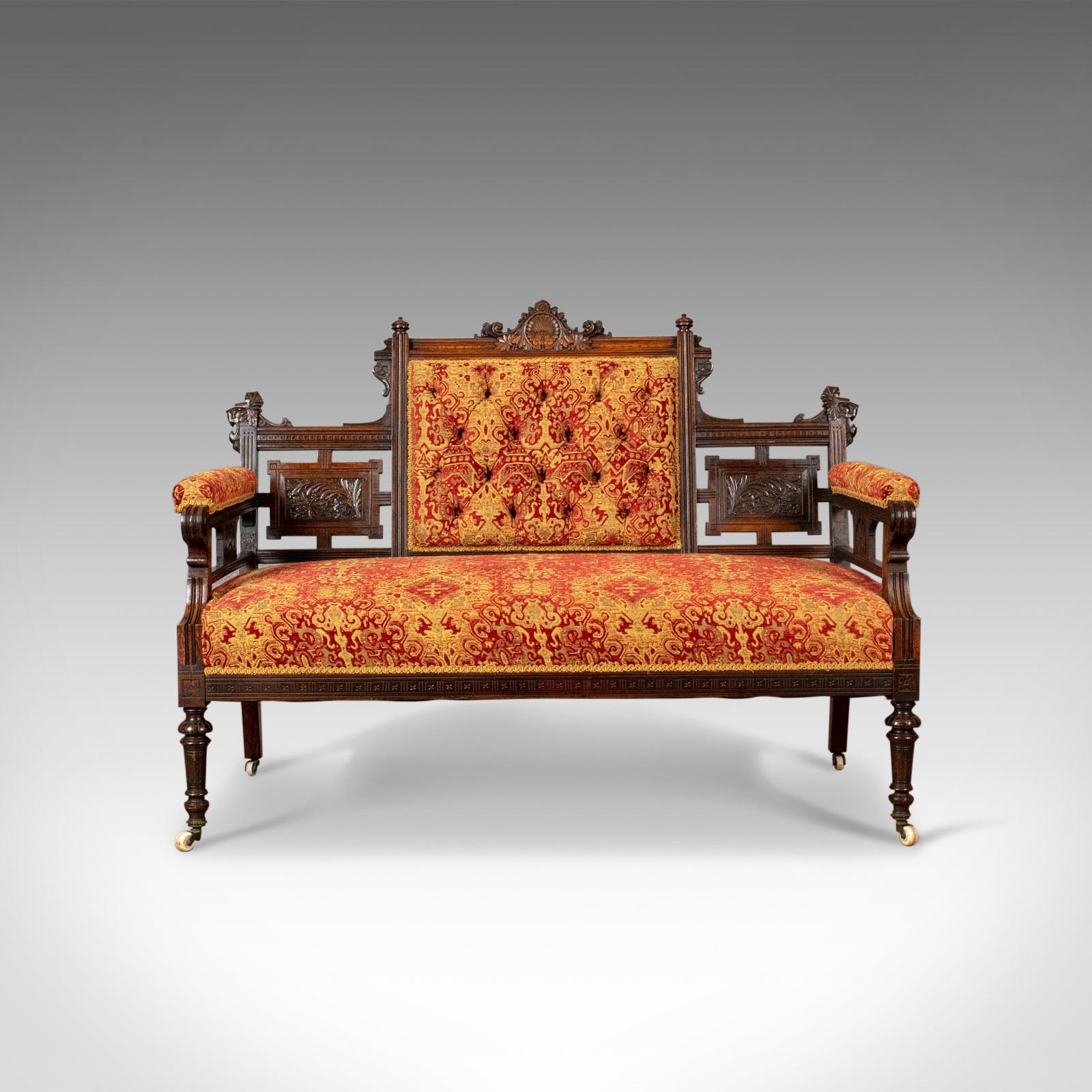 This is an antique settee, a Victorian button back sofa in walnut and finished in a rich damask cloth, 19th century, circa 1880.

The walnut frame displays good colour throughout
Decorated with good quality carved detail with classical
