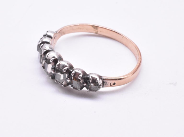 A seven stone half hoop diamond ring