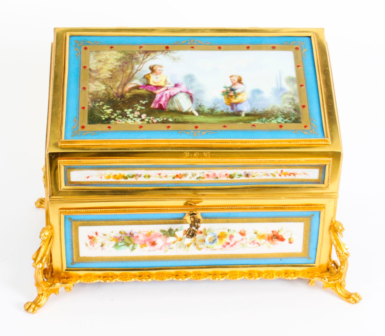 This is an absolutely fabulous antique French Ormolu and Sèvres Porcelain desktop correspondence casket, circa 1870 in date.

Of rectangular form, the front top and sides feature beautiful parcel gilt heightened and jeweled Sèvres Porcelain panels