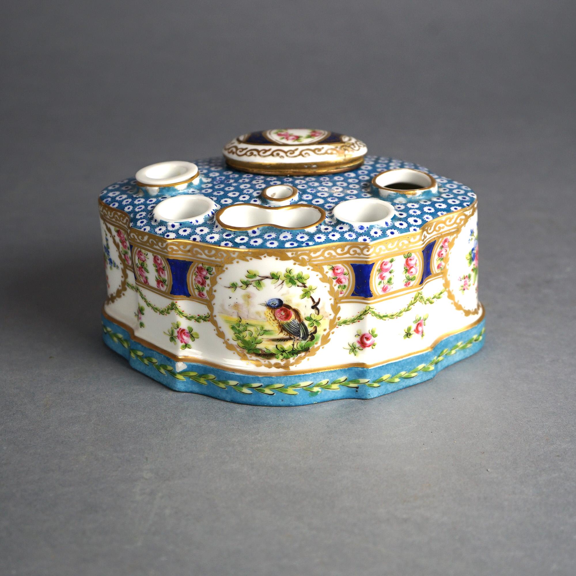Antique French Sevrés inkwell offers porcelain construction in shaped form and having hand painted floral decoration and reserve with a bird, gilt highlights throughout, maker mark en verso as photographed, c1890

Measures - 4
