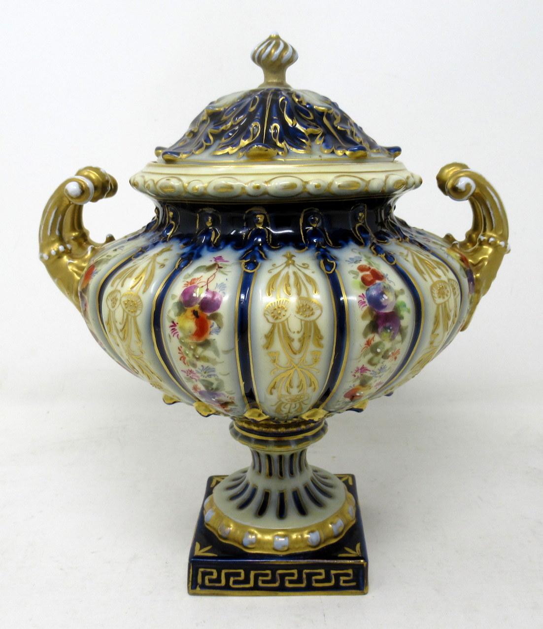 A very stylish German Royal Rudolstadt hand painted twin handle lidded porcelain vase of ovoid outline and impressive proportions, last quarter of the nineteenth century.

The lobed body with heavily gilded mask handles, superbly decorated with