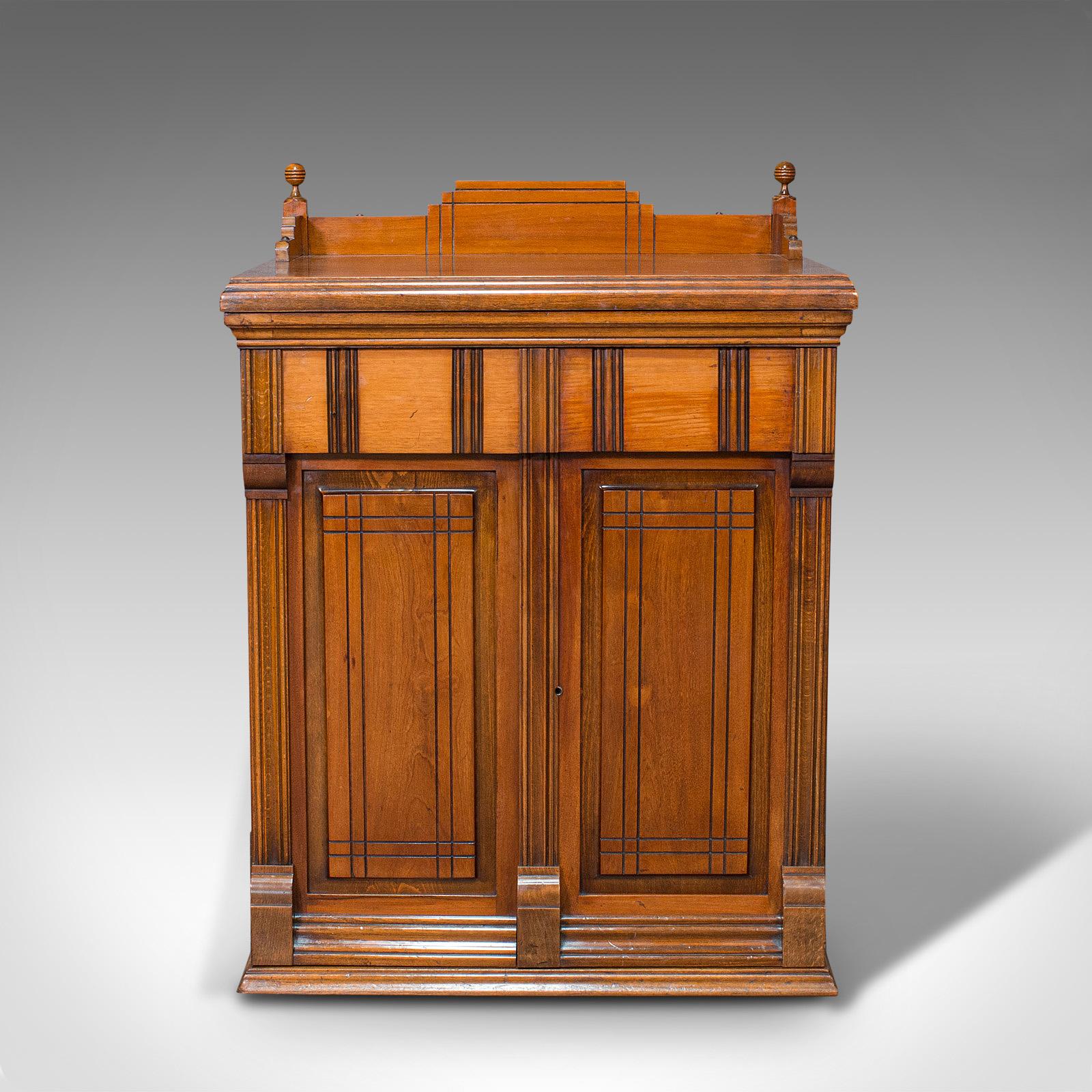 This is an antique sewing machine cabinet. An English, walnut machinist's console, dating to the early 20th century, circa 1920.

Truly captivating machine cabinet with Art Deco taste and fine craftsmanship
Displaying a desirable aged patina