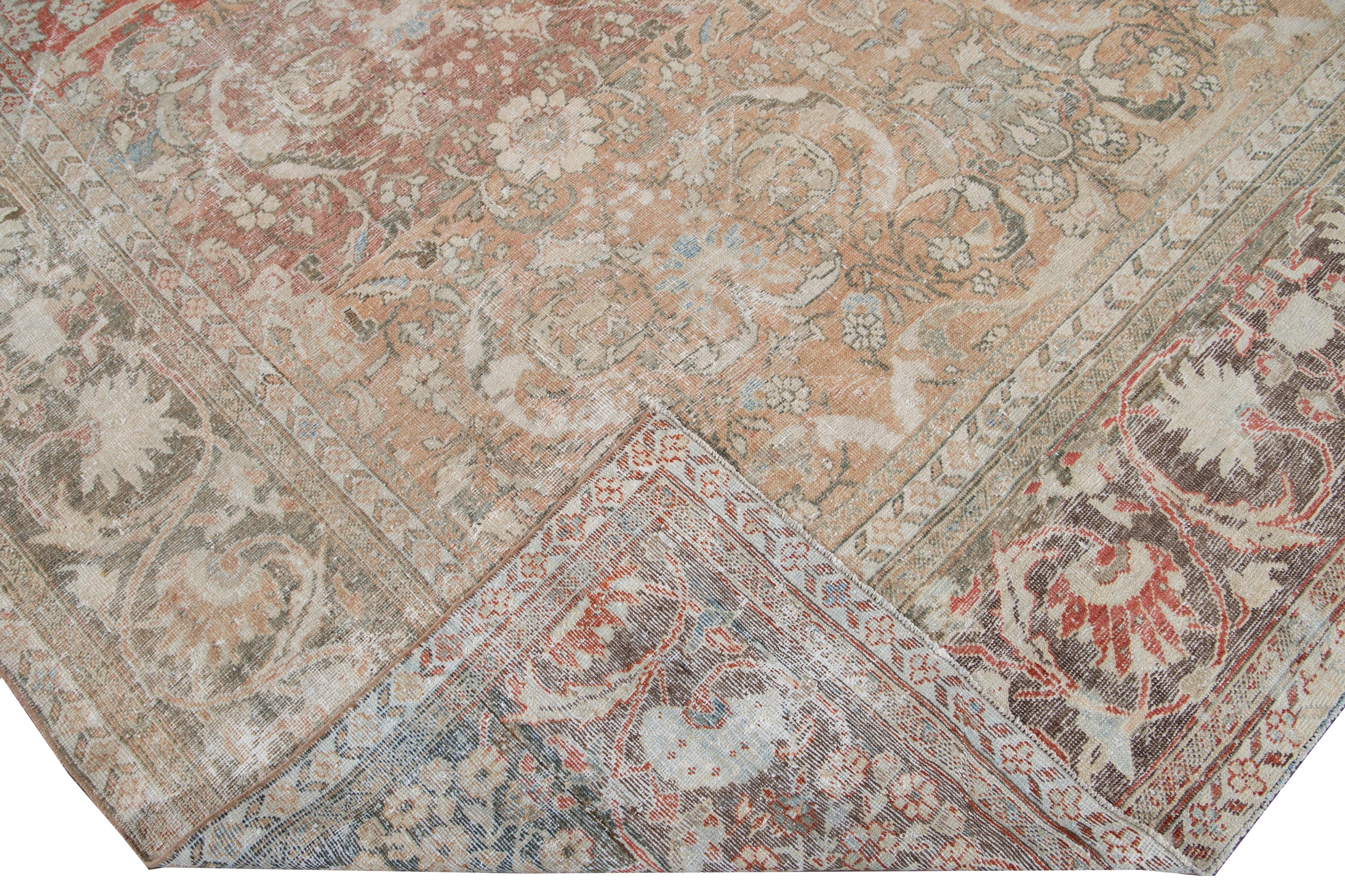 Beautiful antique Mahal hand knotted wool rug with a red field. This rug has a brown frame and multi-color accents in a gorgeous all-over distressed shabby chic floral design.

This rug measures: 10'1