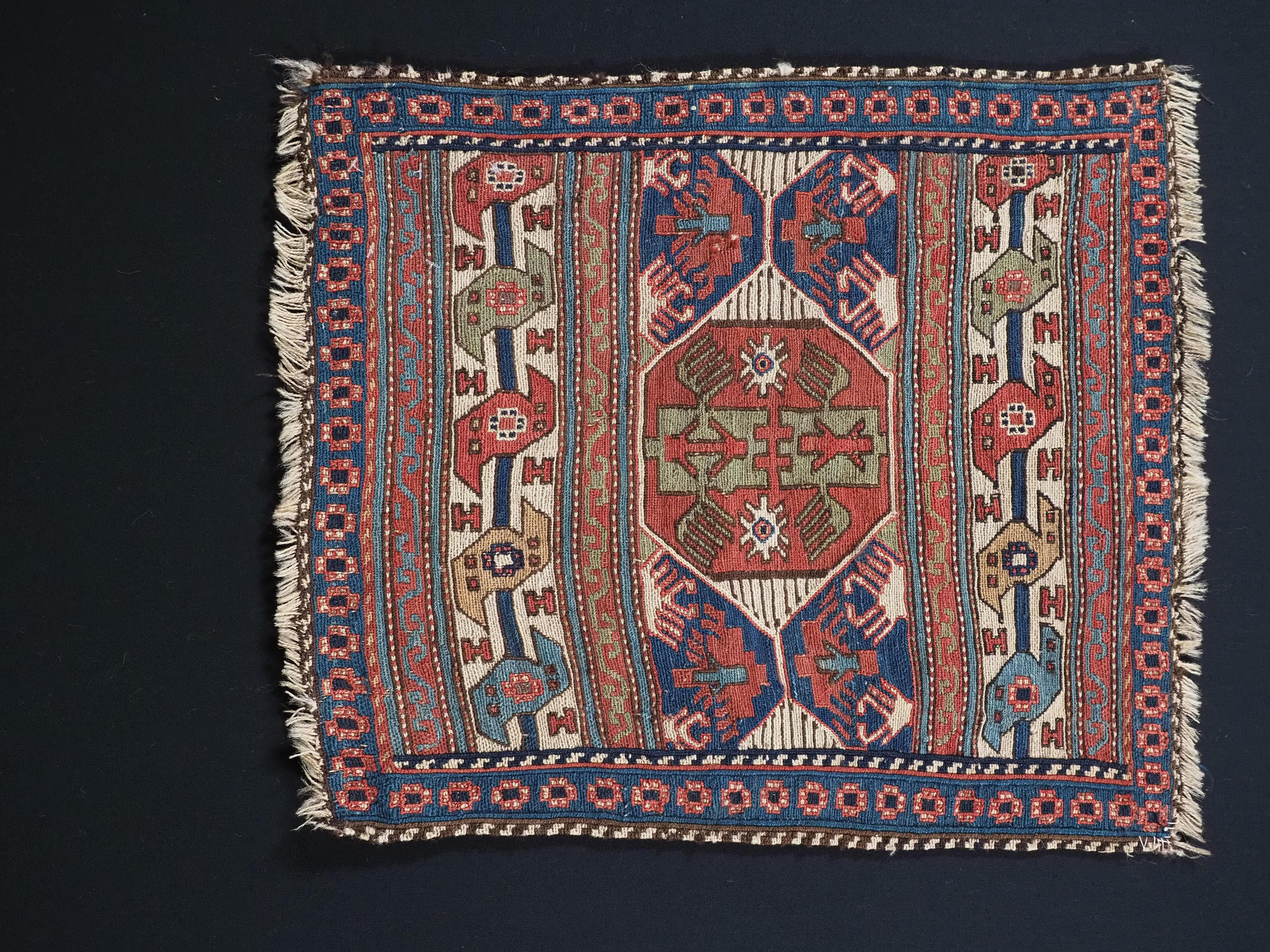 Size: 1ft 8in x 1ft 6in (51 x 45cm).

Antique Shahsavan saddle bag face in soumak technique.

Circa 1870.

An outstanding soumak bag face in a classic Shahsavan design with stylised birds and dragons , superb natural dyes throughout.

The bag face
