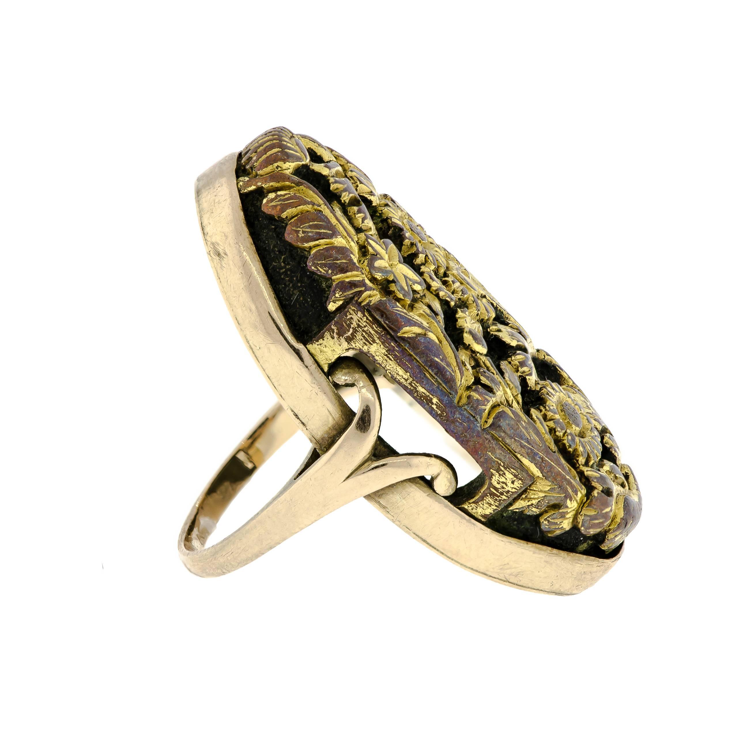 Antique Shakudo mixed metal ring with an elaborate floral pattern set in a yellow gold mount