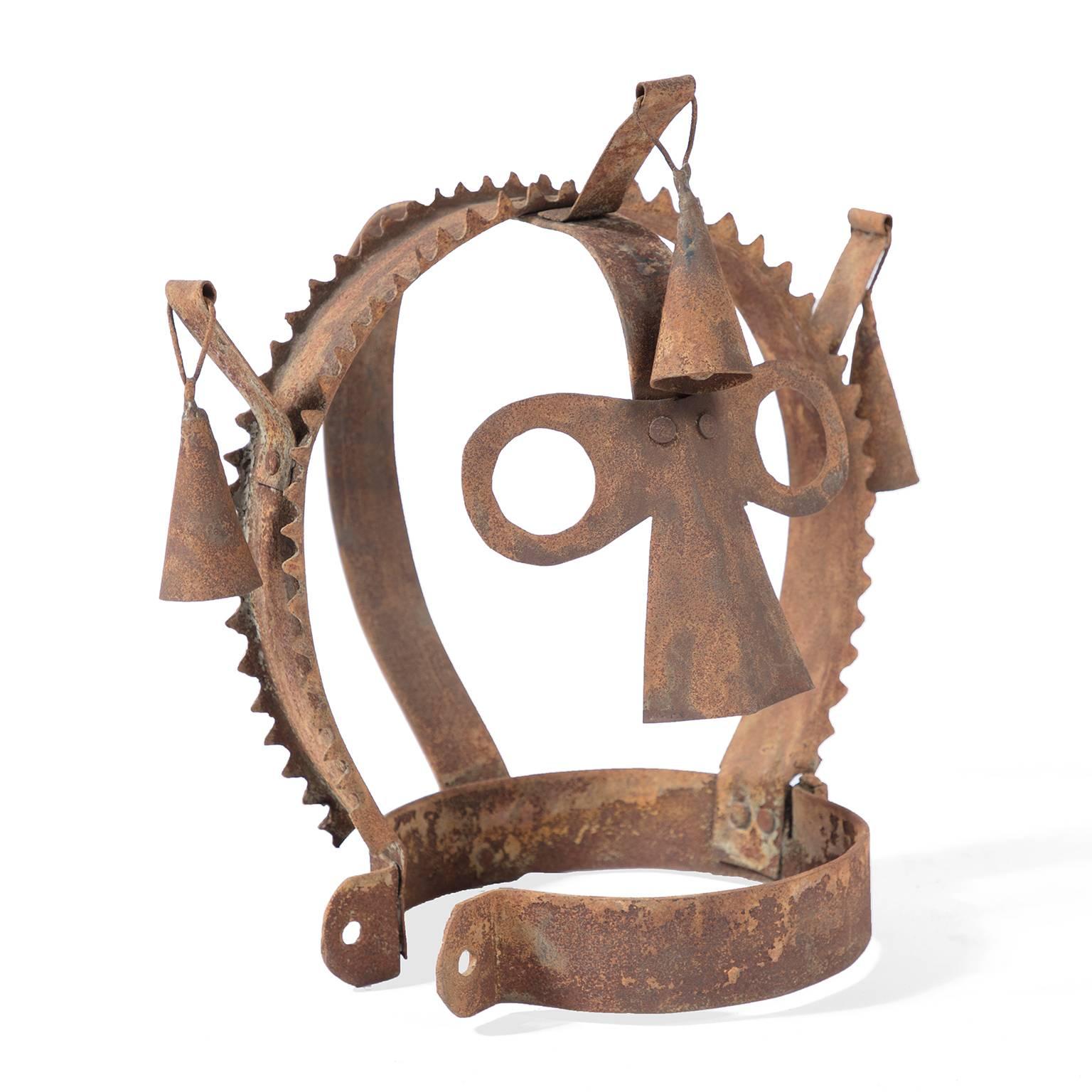 Also known as a scold’s bridle or witch’s bridle, helmets like these were used in Scotland, England and Wales from the 16th through the 18th centuries. The armature has a flattened nose, round eyes, and three bells, with a metal collar.
