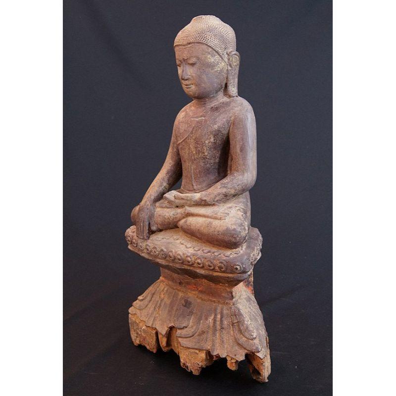 Material: wood
57 cm high 
31 cm wide
Weight: 5.6 kgs
Bhumisparsha mudra
Originating from Burma
16th Century
Traces of gold can be found.
 