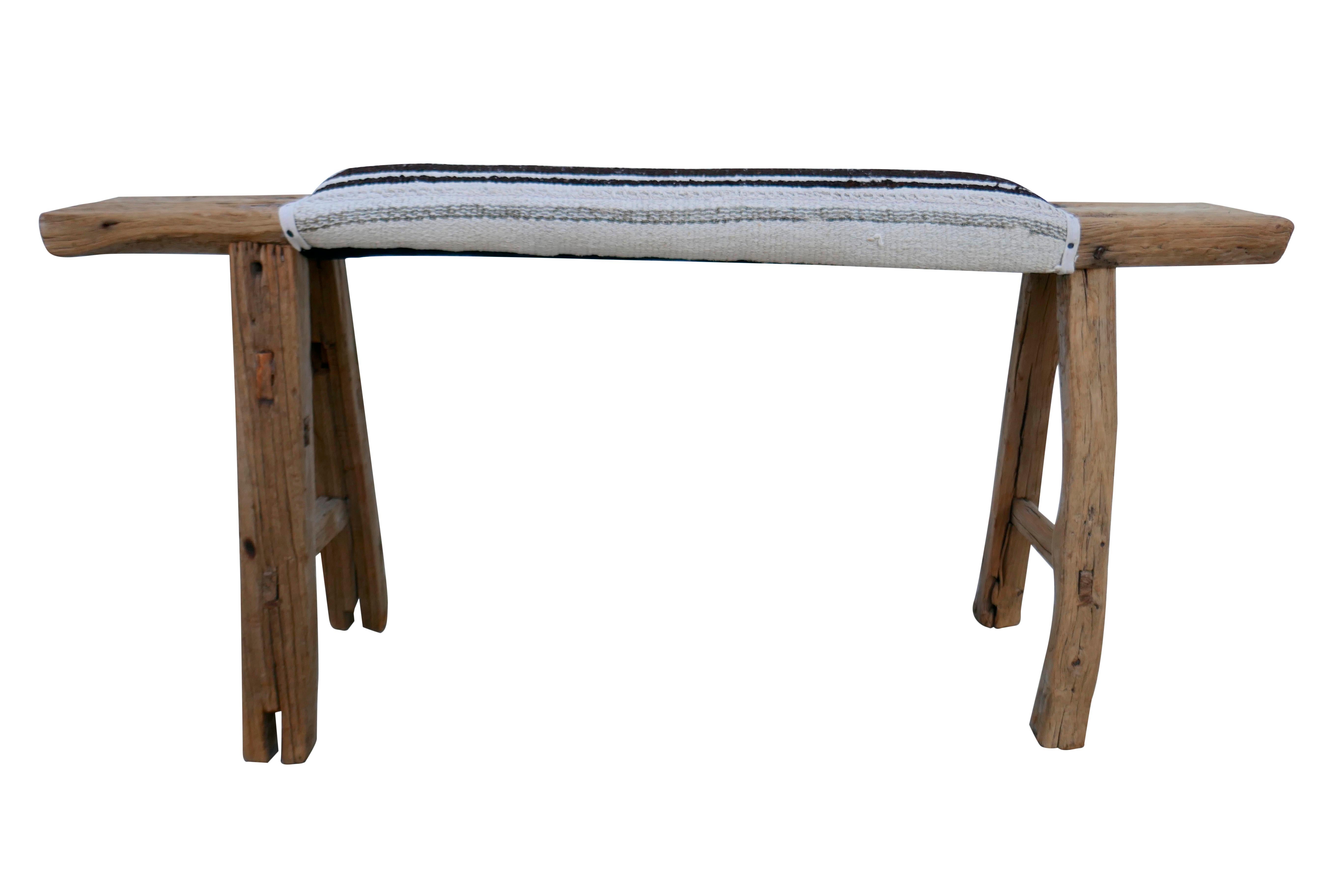 Vintage authentic Shandong elmwood bench upholstered in authentic vintage Anatolian Berber hand-spun Kilim hemp in neutral tones. Primitively hand-built with mortise & tenon joinery. Showing much desirable natural age character and patina.