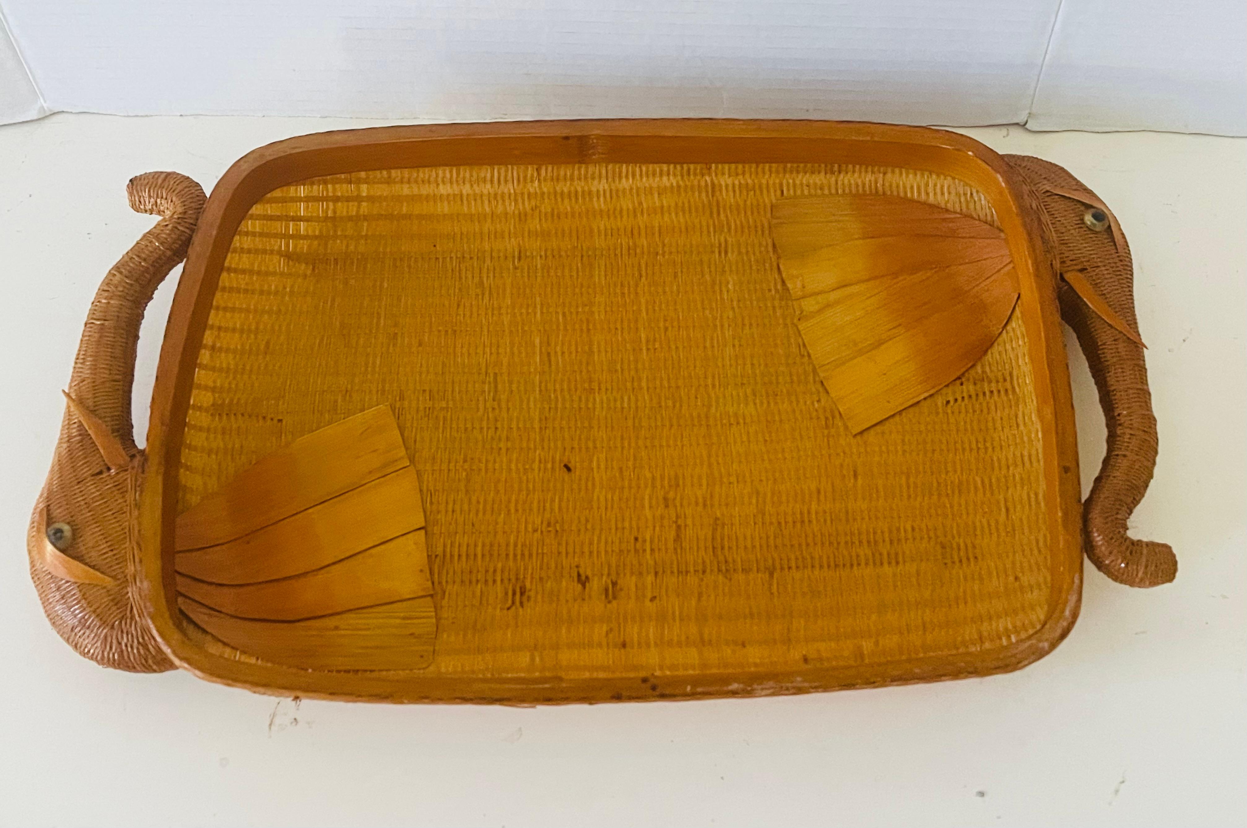 Antique Shanghai handmade wicker tray with elephant heads handles. Bead eyes decorated with.