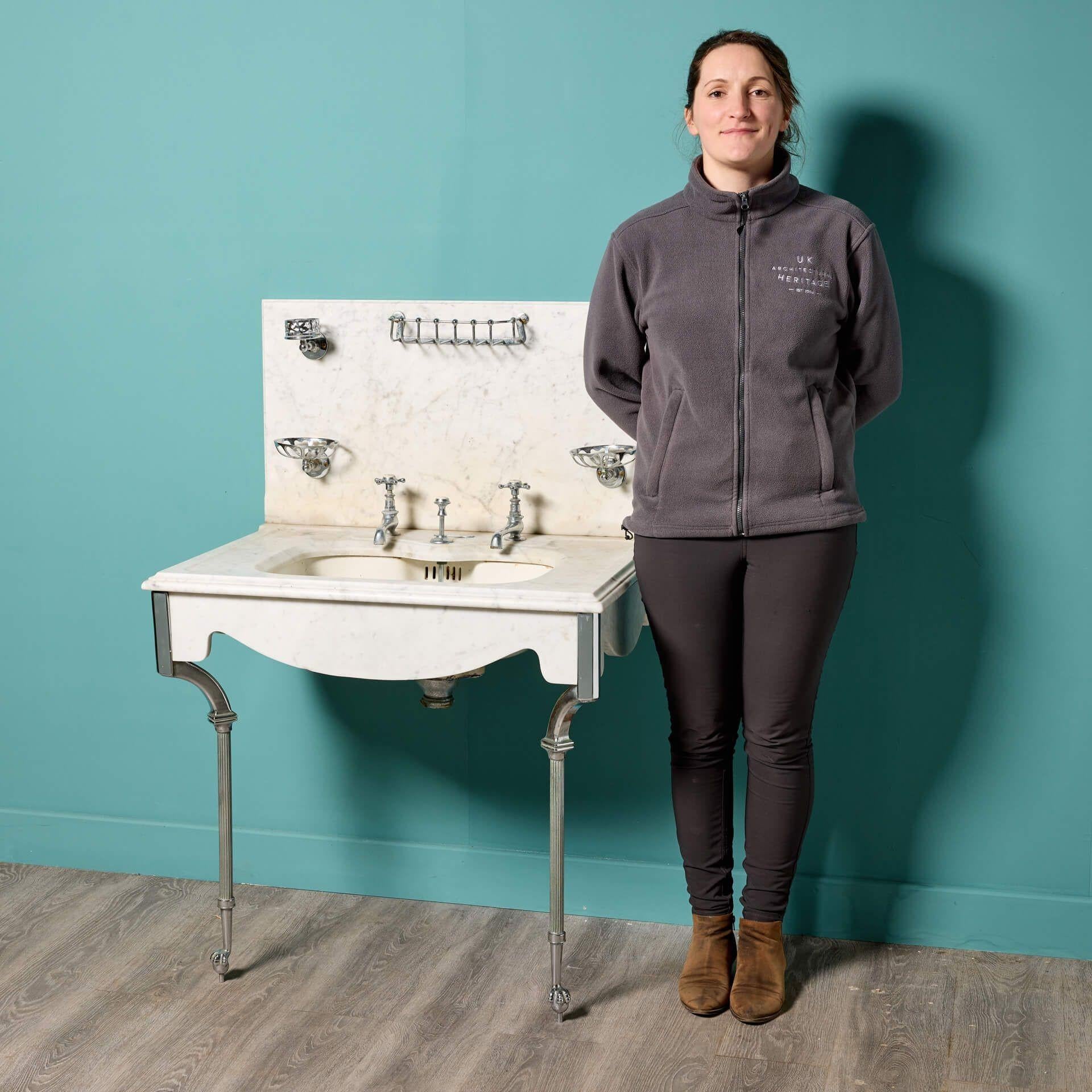 An antique Shanks Carrara marble sink sourced from a country house in Cheshire, England. Dating from the early 20th century, this beautiful Shanks sink has an original shaped marble skirt and undercoated porcelain basin, making it a rare piece and