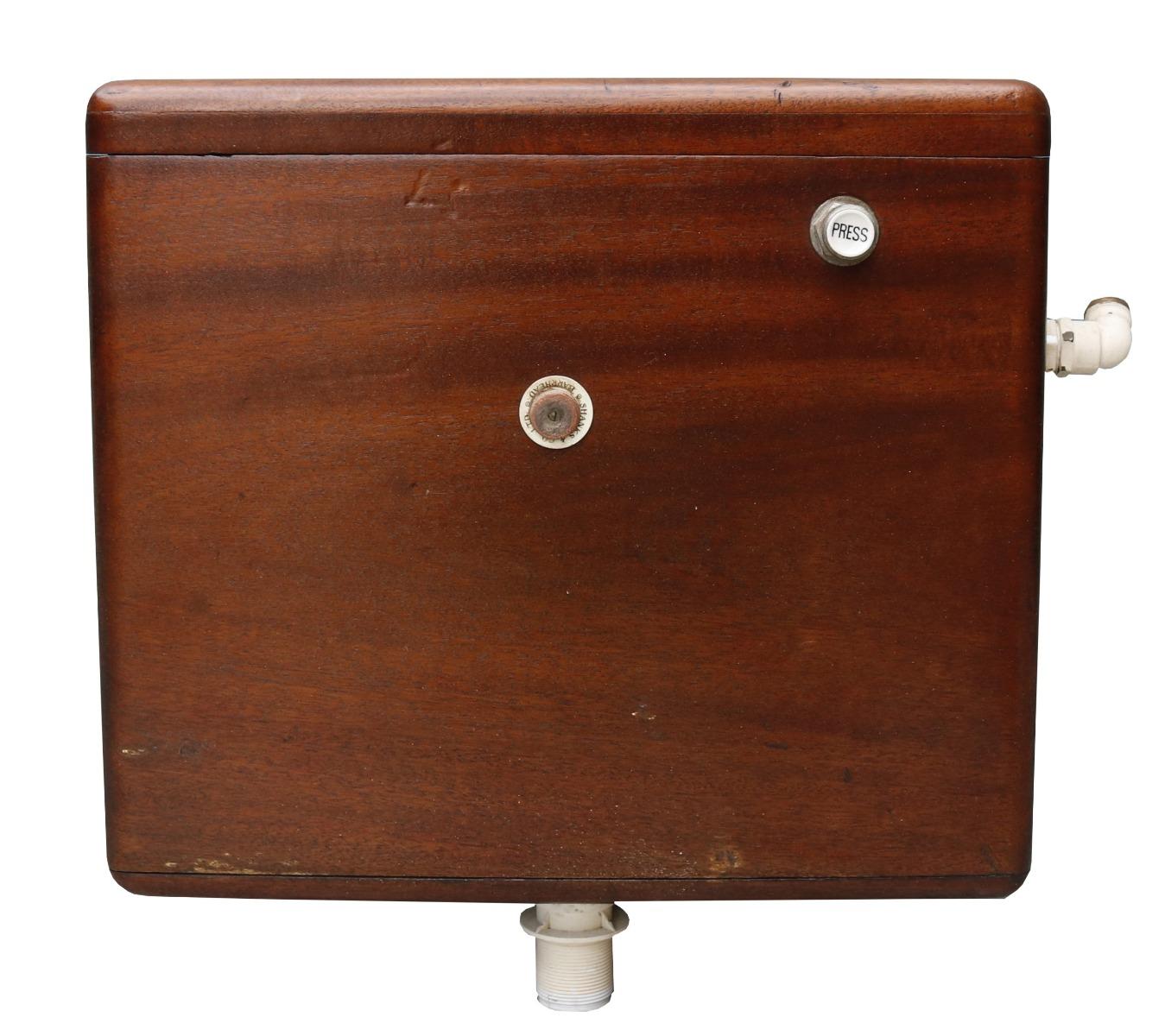 A reclaimed Mahogany low level toilet cistern salvaged from a large country estate in southern England. Manufactured by Shanks & Co.