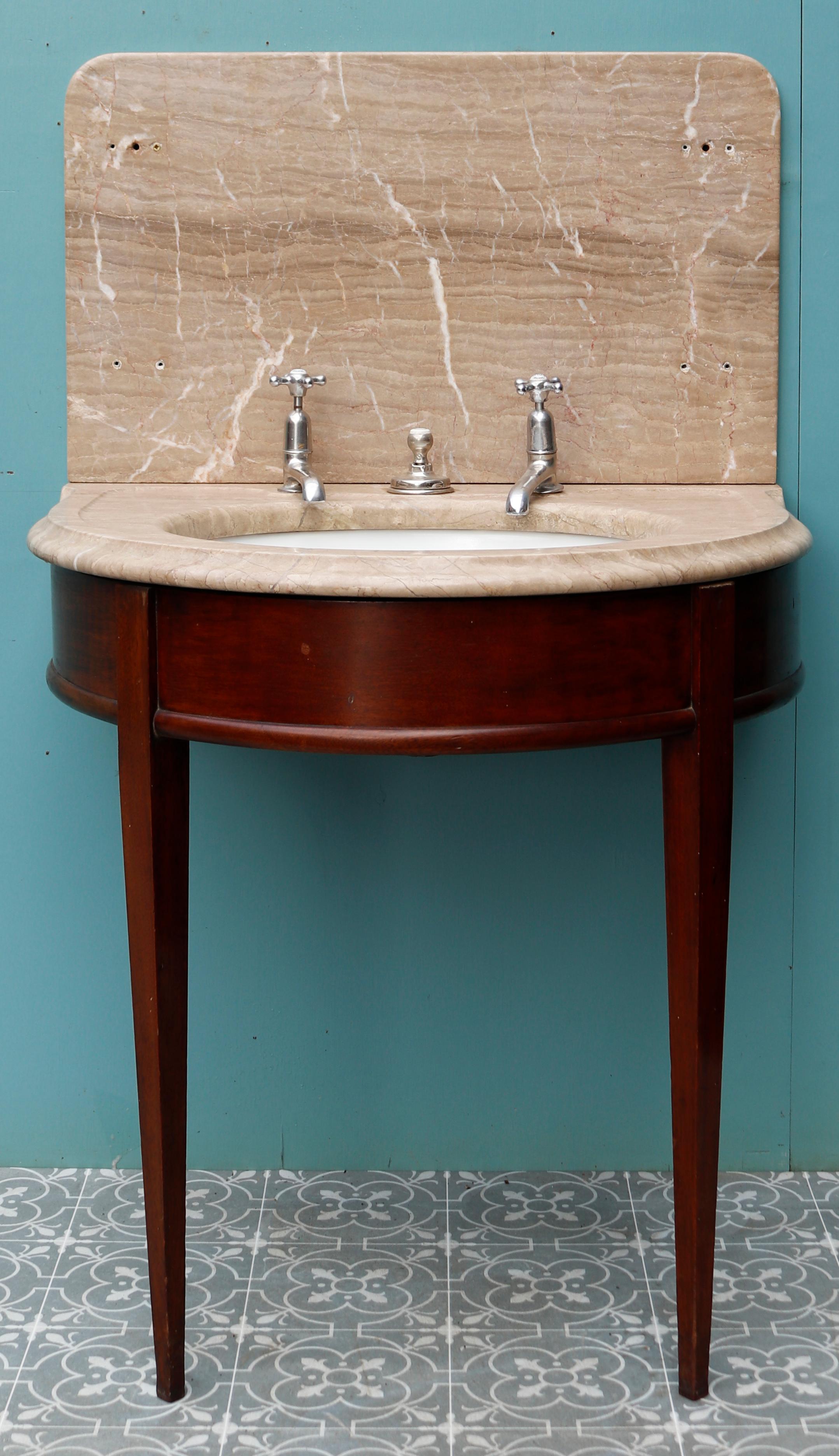 An original reclaimed Shanks wash basin or sink. Mottled brown marble top and splashback with undermounted porcelain basin. Supported on a mahogany stand.
 
Additional Dimensions:
 
Overall height 123.5 cm
 
Height of countertop 79 cm
 
Width 76.5