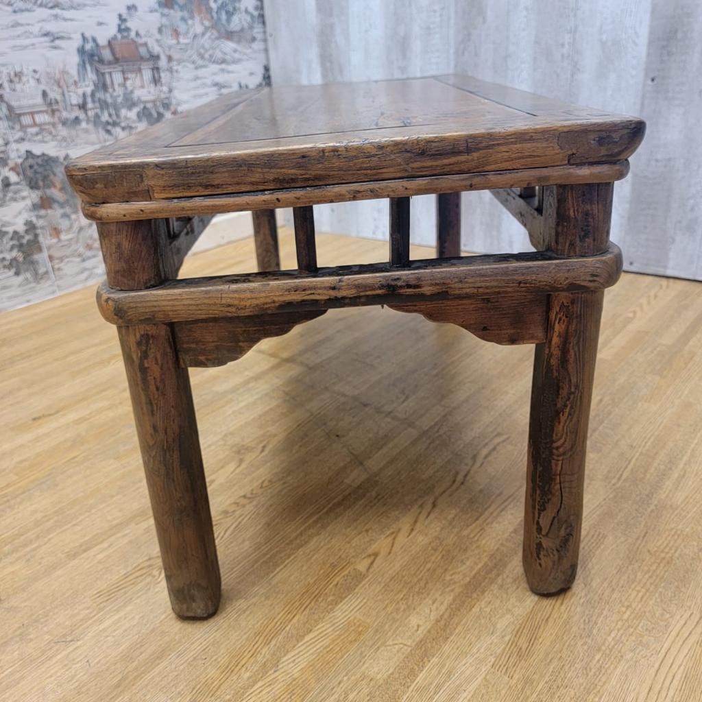 Antique shanxi Province elmwood coffee / side table.

This antique Chinese rectangle coffee table can be also used as a game table. The table was made in the Shanxi Province. With straight lines and round legs, the table is very solid and kept in
