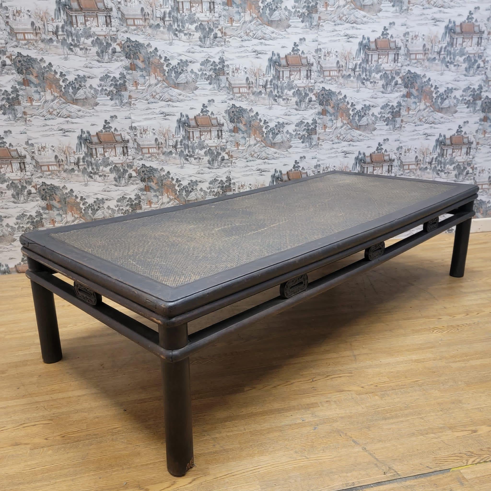 Antique Shanxi province hand woven rattan top elm coffee table

This elm wood round leghed coffee table and hand woven rattan top is backed with solid elm wood beneath for durability and strength. This coffee table has its original color and
