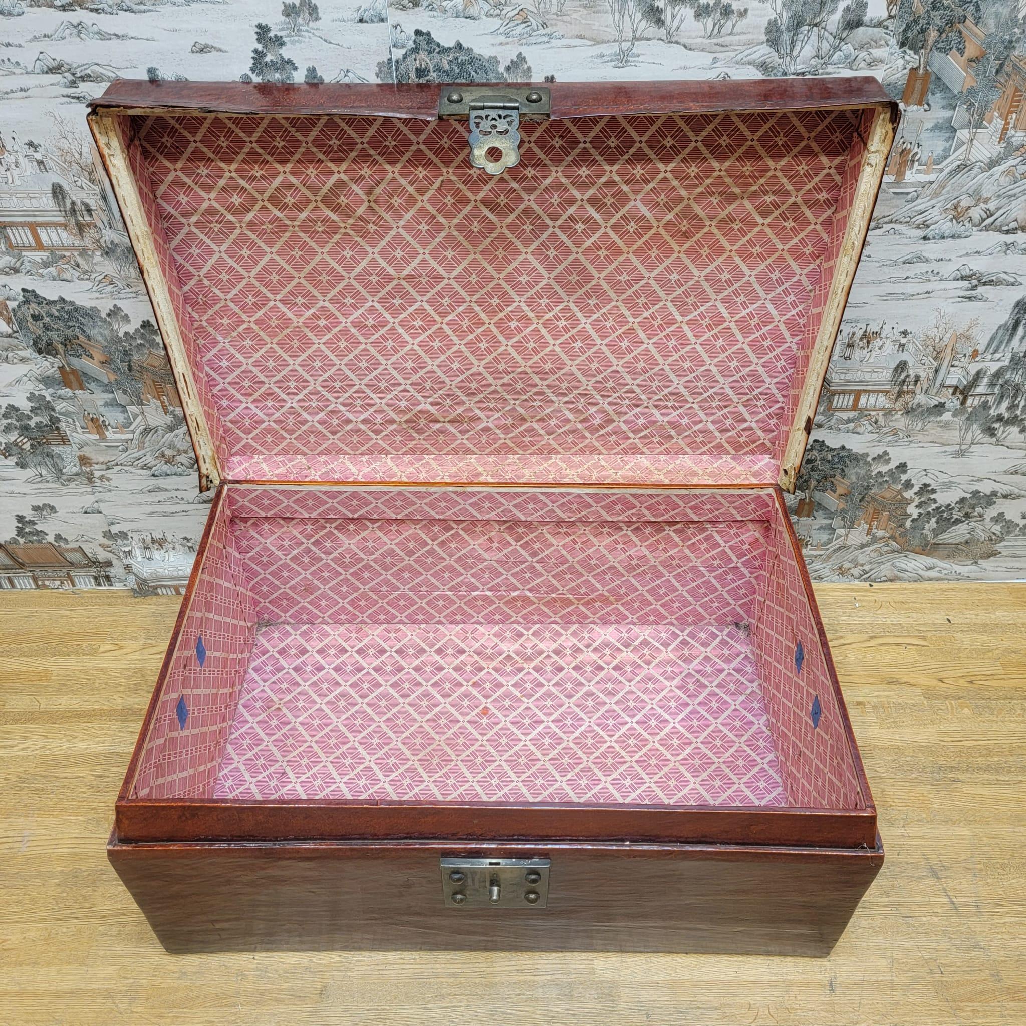 Antique Shanxi province red elm leather wrapped travel box.

This antique travel box with lid and original hardware is from the Shanxi Province of China. It is wrapped in leather with its original color and patina. 

Circa: