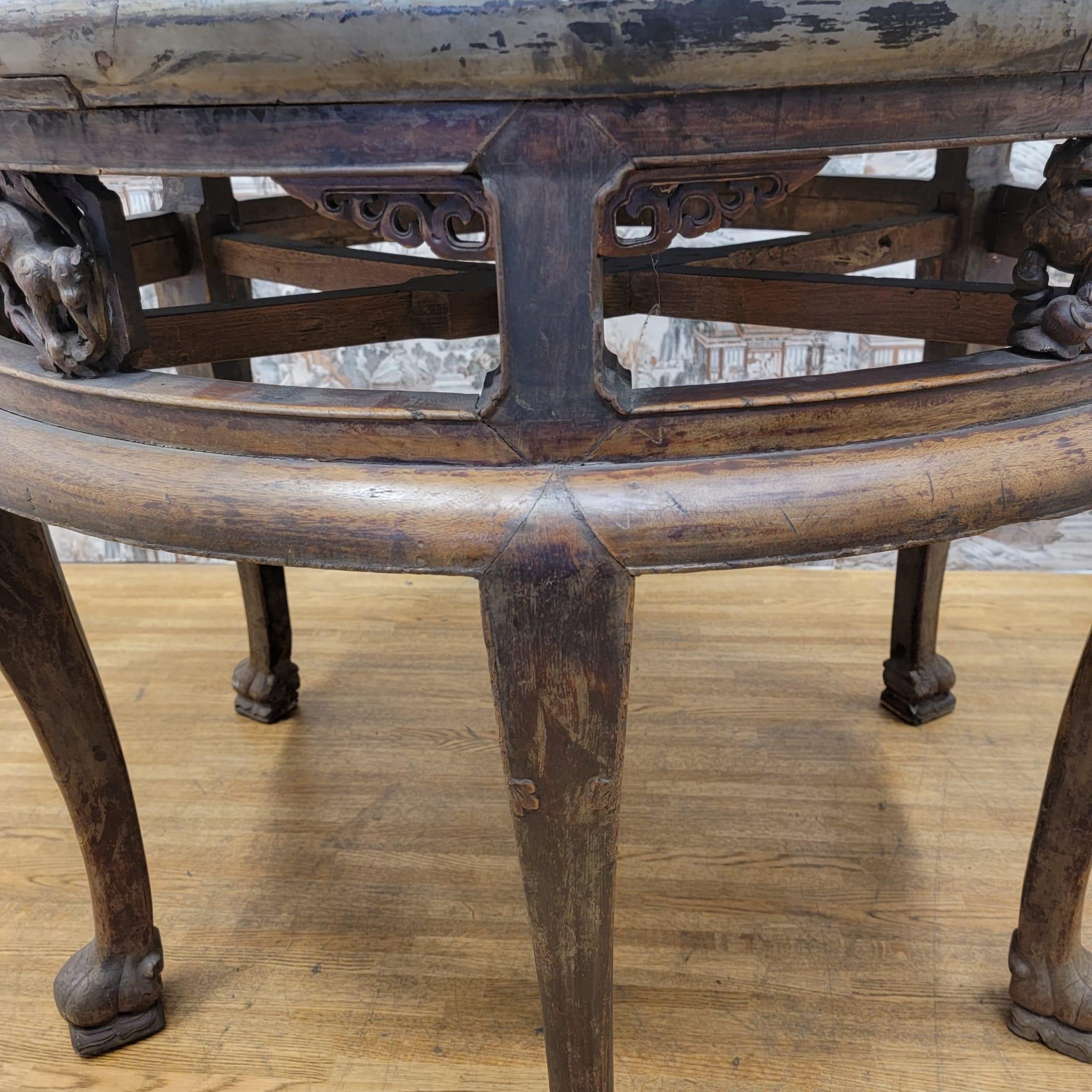Antique Shanxi province tall elm round accent table with animal carvings on Apron

This elm, tall, round table with carved apron with animals and carvings has 6 legs. With original color and patina. Used for tea and games. Can be used in a hallway