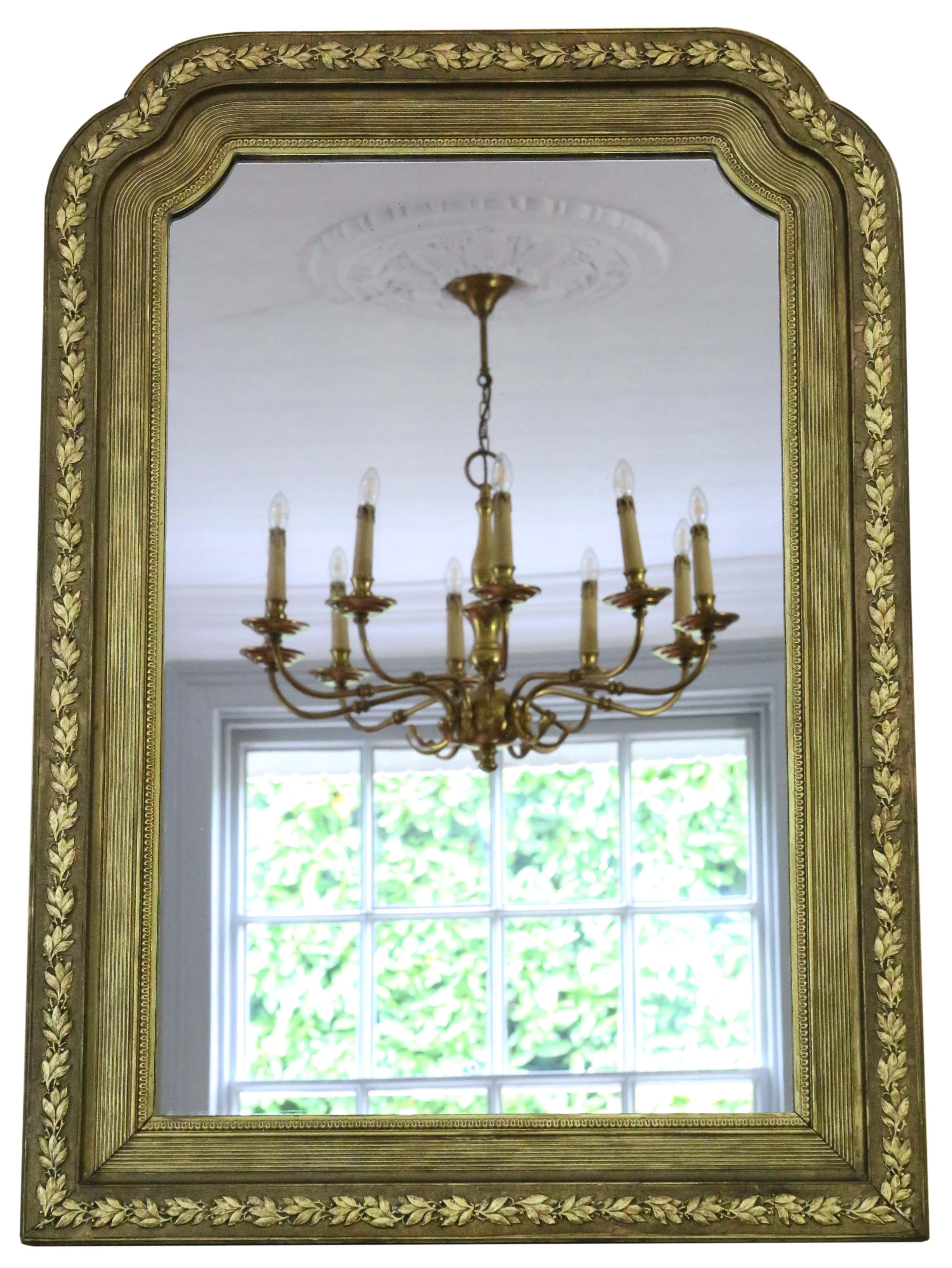 Antique shaped 19th Century large quality gilt overmantle or wall mirror. Lovely charm and elegance. Original finish with minor losses, refinishing and touching up.

This is a lovely, rare mirror. A bit different and quite special.

An impressive