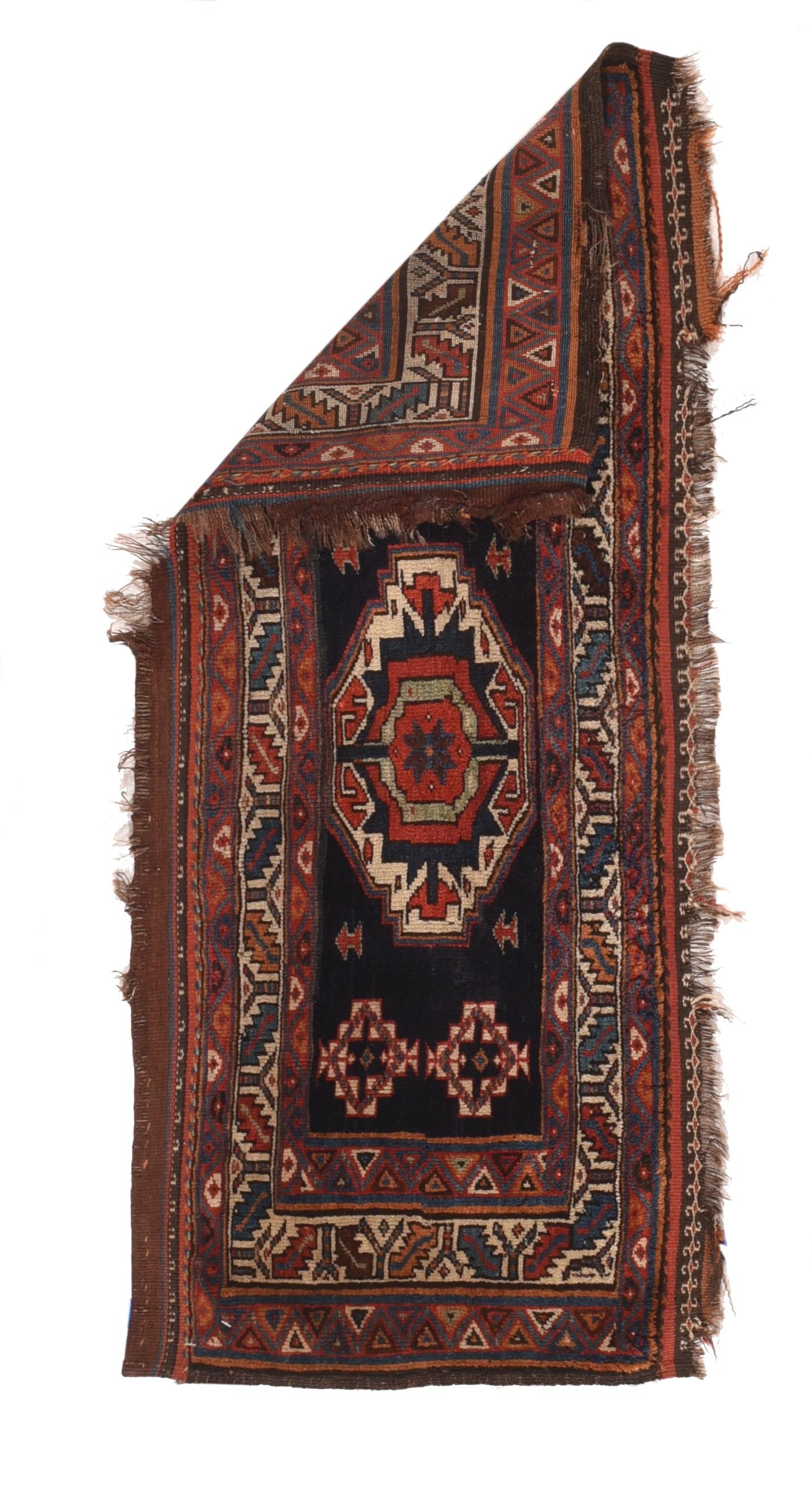 Antique Shashsavan rug 1.6'' x 3.3''. This authentic Central Persian nomadic weaving shows an ecru Tekke Turkmen-style gul on a navy ground with small, stepped ivory corner motives. The main border has an ecru ground with a slanted leaf and simple