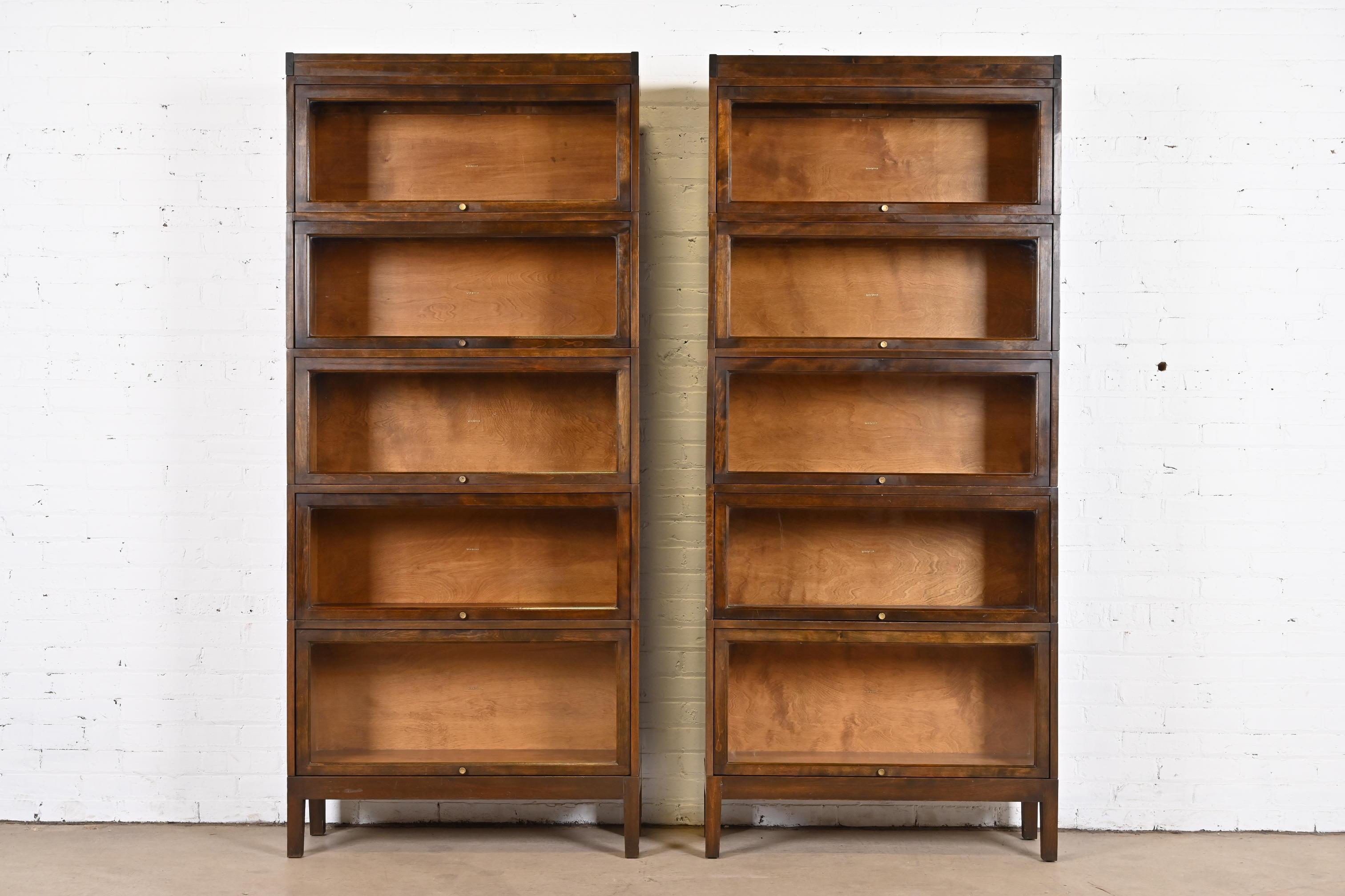 A gorgeous pair of antique Arts & Crafts five-stack barrister bookcases

By Shaw Walker

USA, circa 1920s

Mahogany, with glass front doors and brass hardware.

Measures: 34