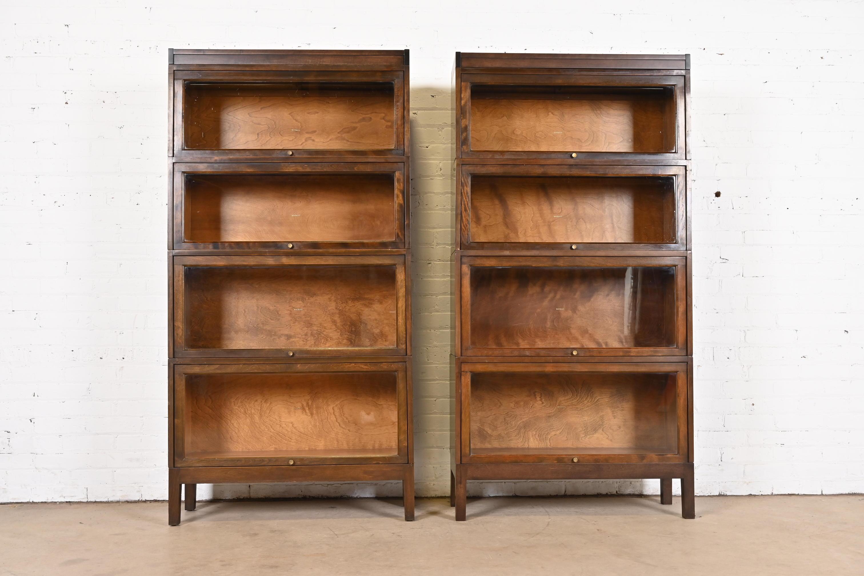 A gorgeous pair of antique Arts & Crafts four-stack barrister bookcases

By Shaw Walker

USA, Circa 1920s

Mahogany, with glass front doors and brass hardware.

Measures: 34