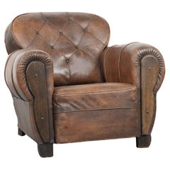 Antique sheepskin armchair with a luxurious look and finished with wood