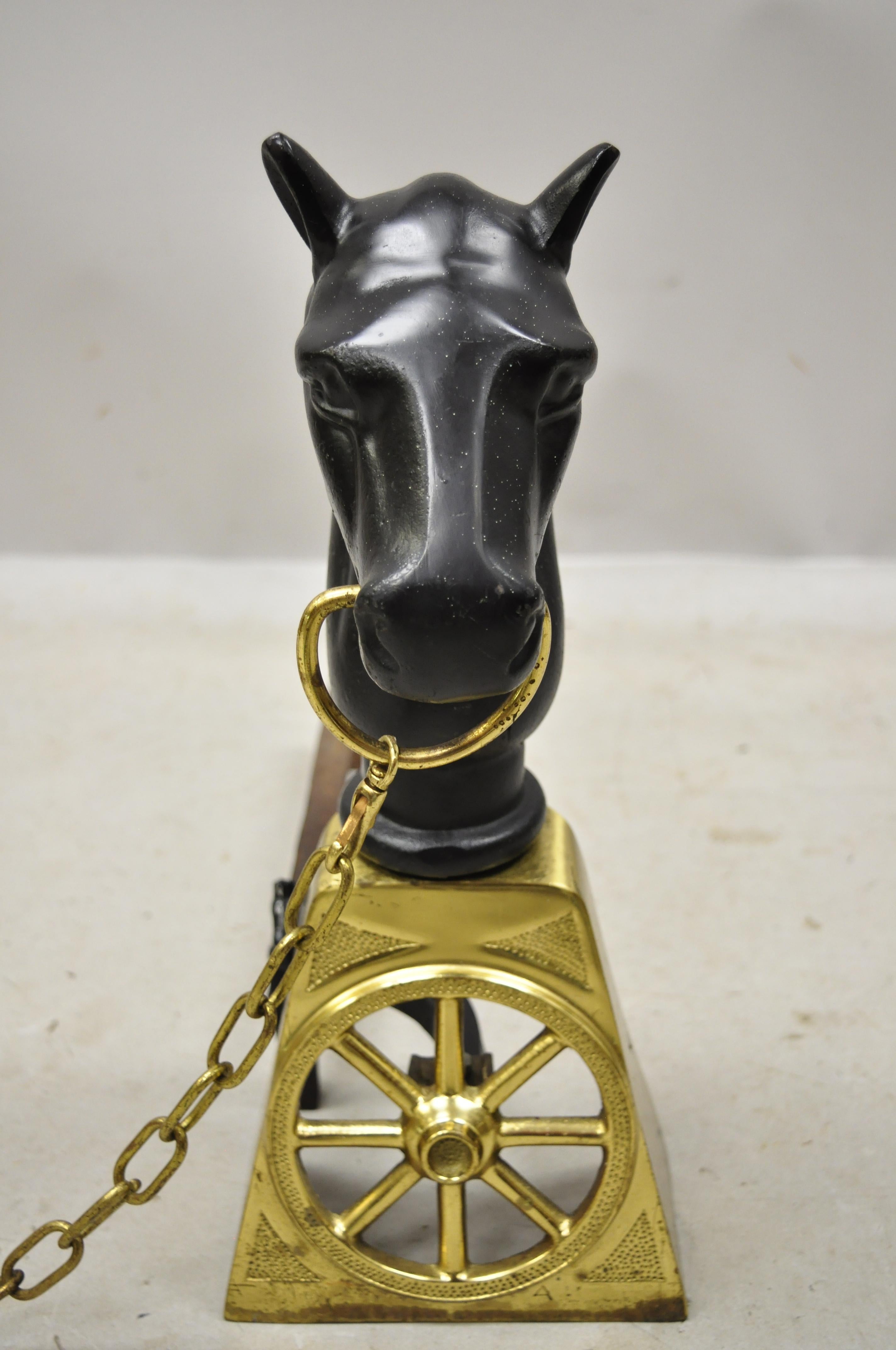 Pair of antique Sheffield cast iron and brass horse Equestrian fireplace andirons. Item features cast iron horse forms, small cast iron horse head finials, cast iron log supports, brass wagon wheel, brass chain, original stamp, very nice vintage