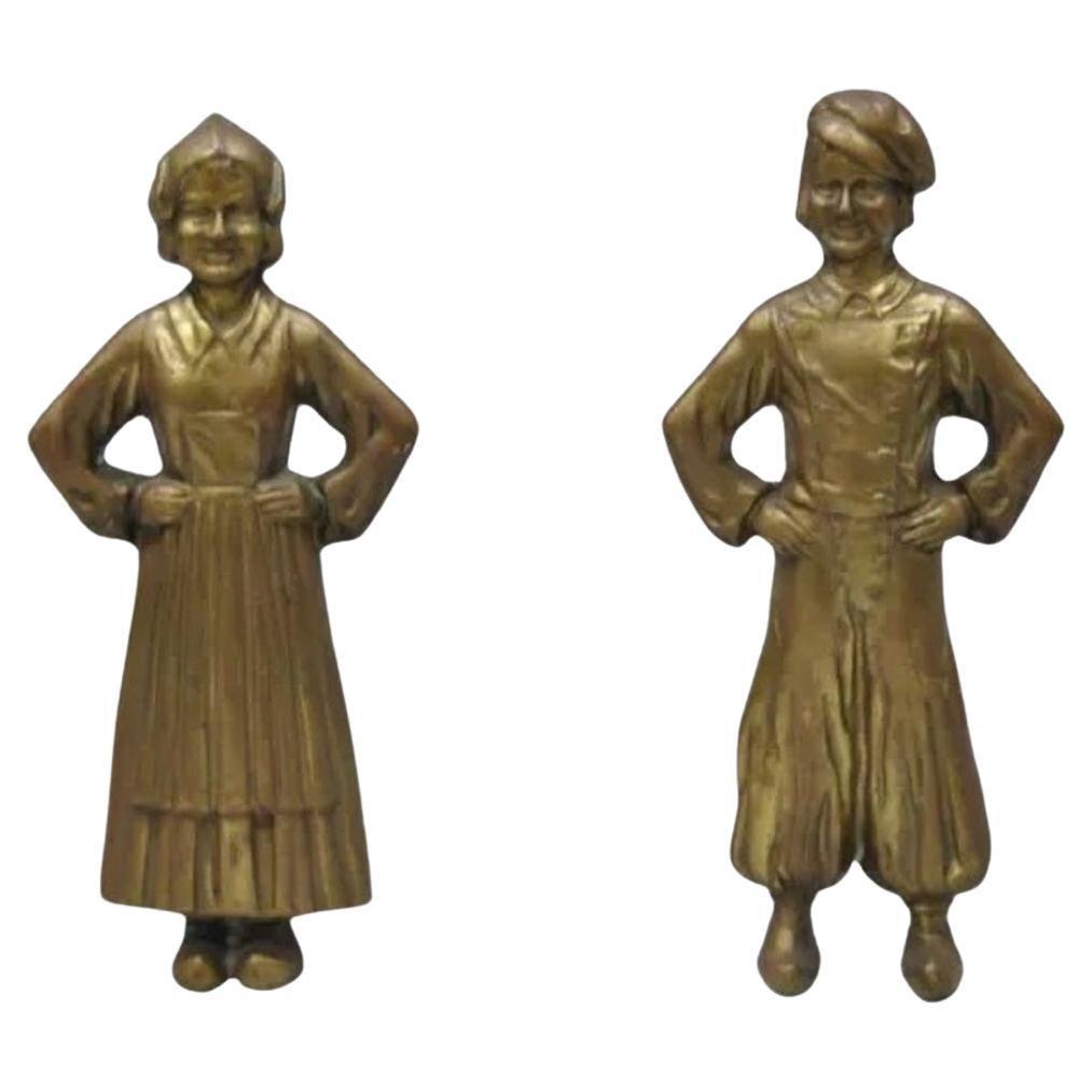 Antiguo niño y niña holandeses de Sheffield de bronce y hierro fundido para chimenea - Pareja en venta