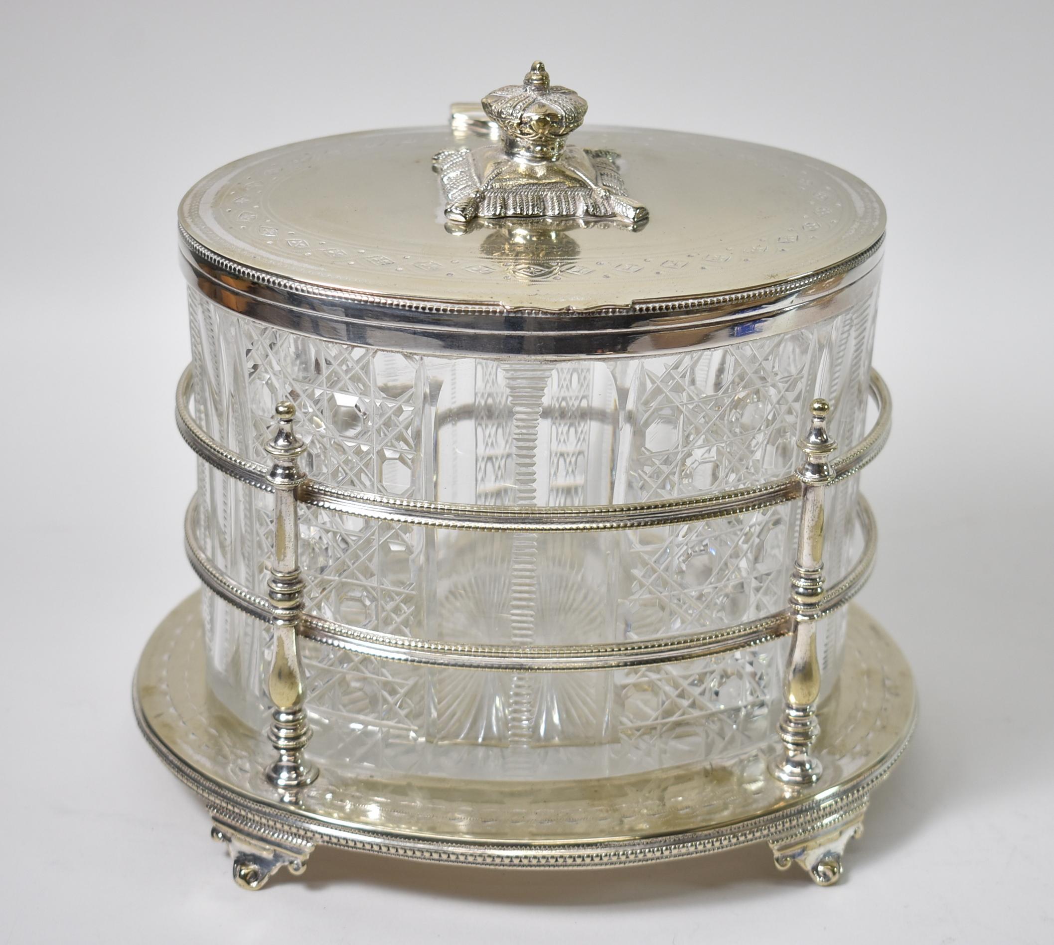 Antique hallmarked Sheffield silver and cut glass biscuit box/jar/barrel. Crown sitting on a pillow on the lid detail. Cut glass insert. Very nice condition. Dimensions: 6.75
