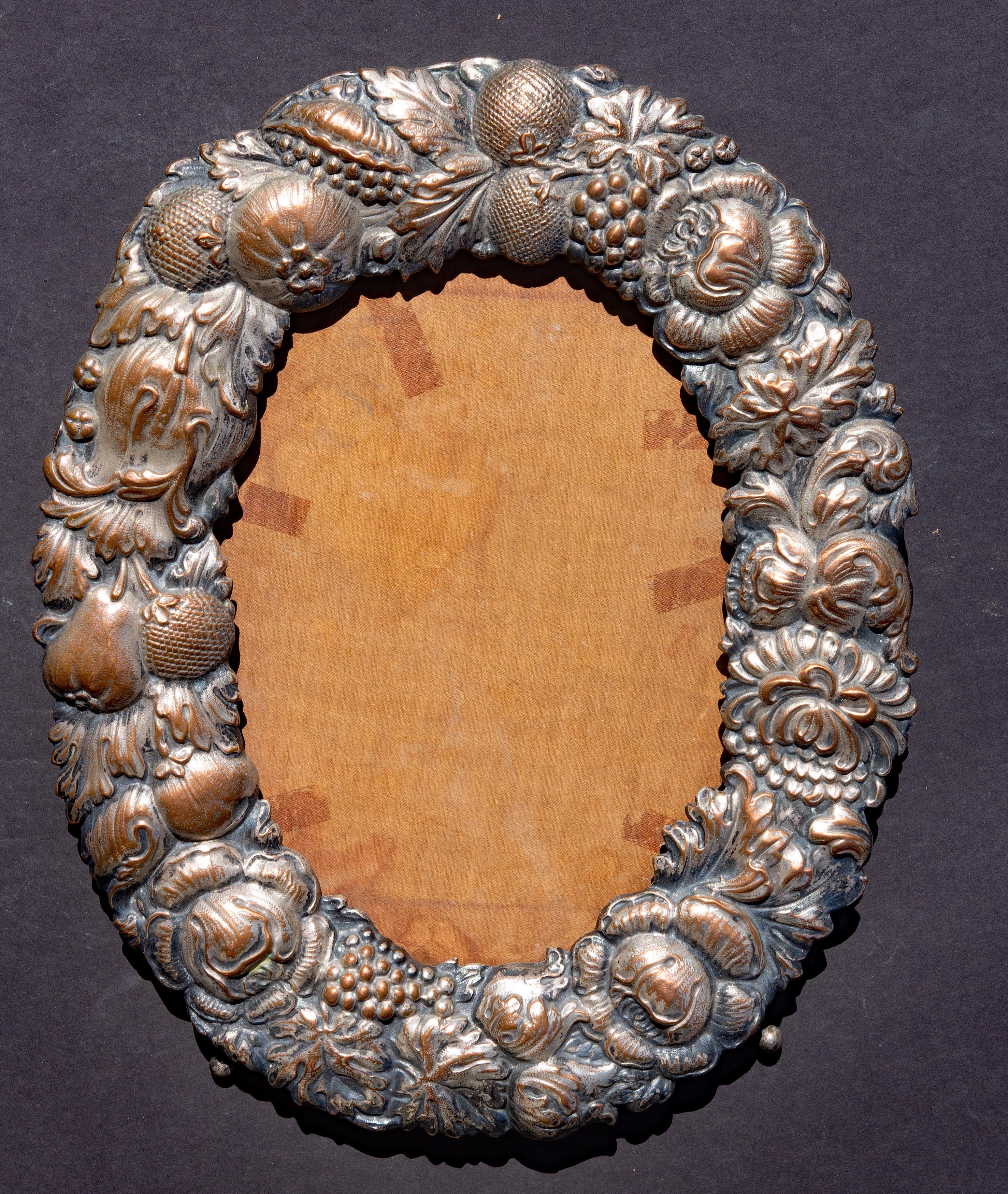 Antique repousse Sheffield table top frame. Hand wrought silver on copper. With original silk backing. 