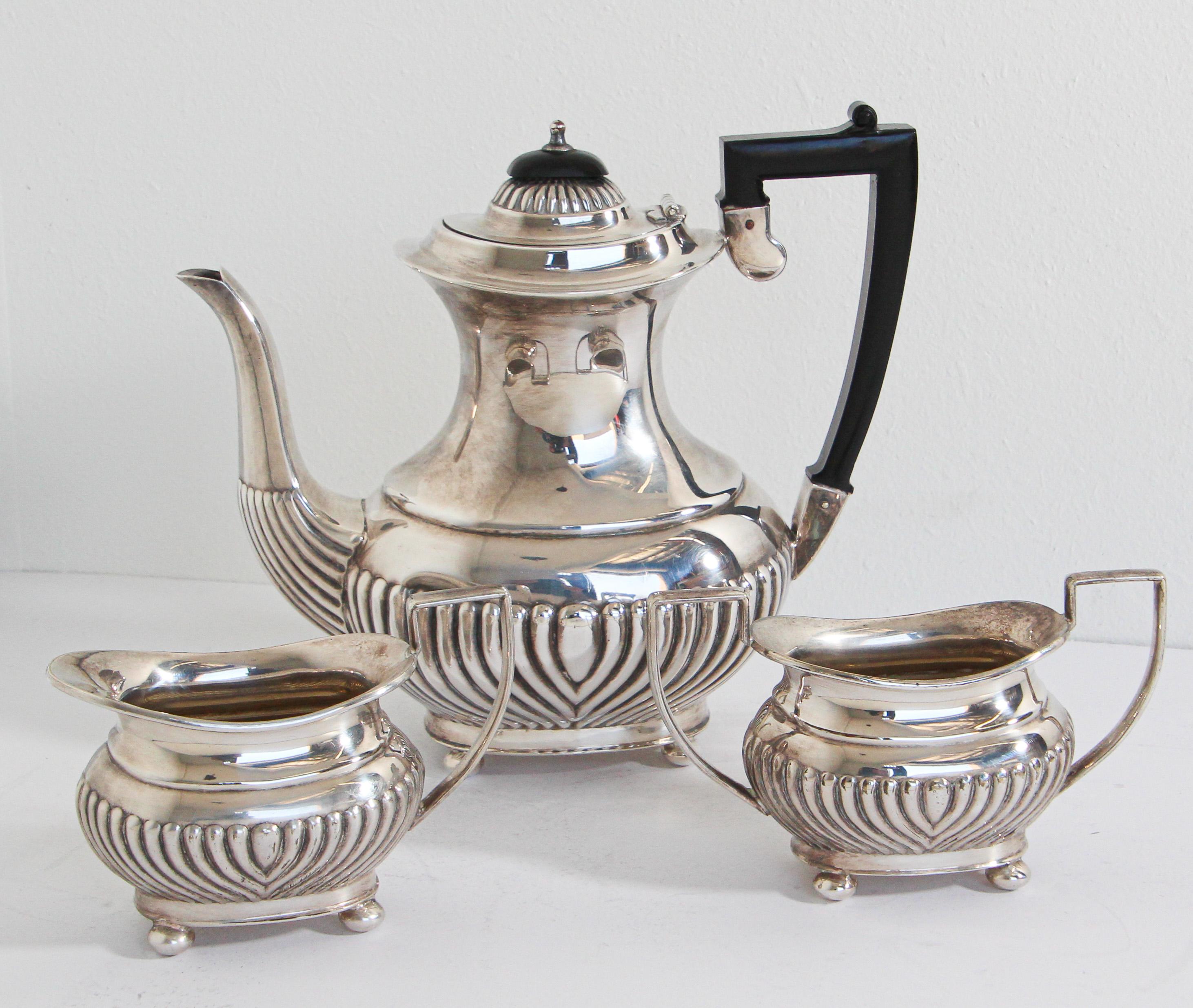 Elegant classic antique sheffield silverplate tea set- 3 pieces.
These are silver plated with black Bakelite handles and lid knobs.
They are from circa. 1920's-1930's, they look to have been well taken care of and recently polished.
This service set