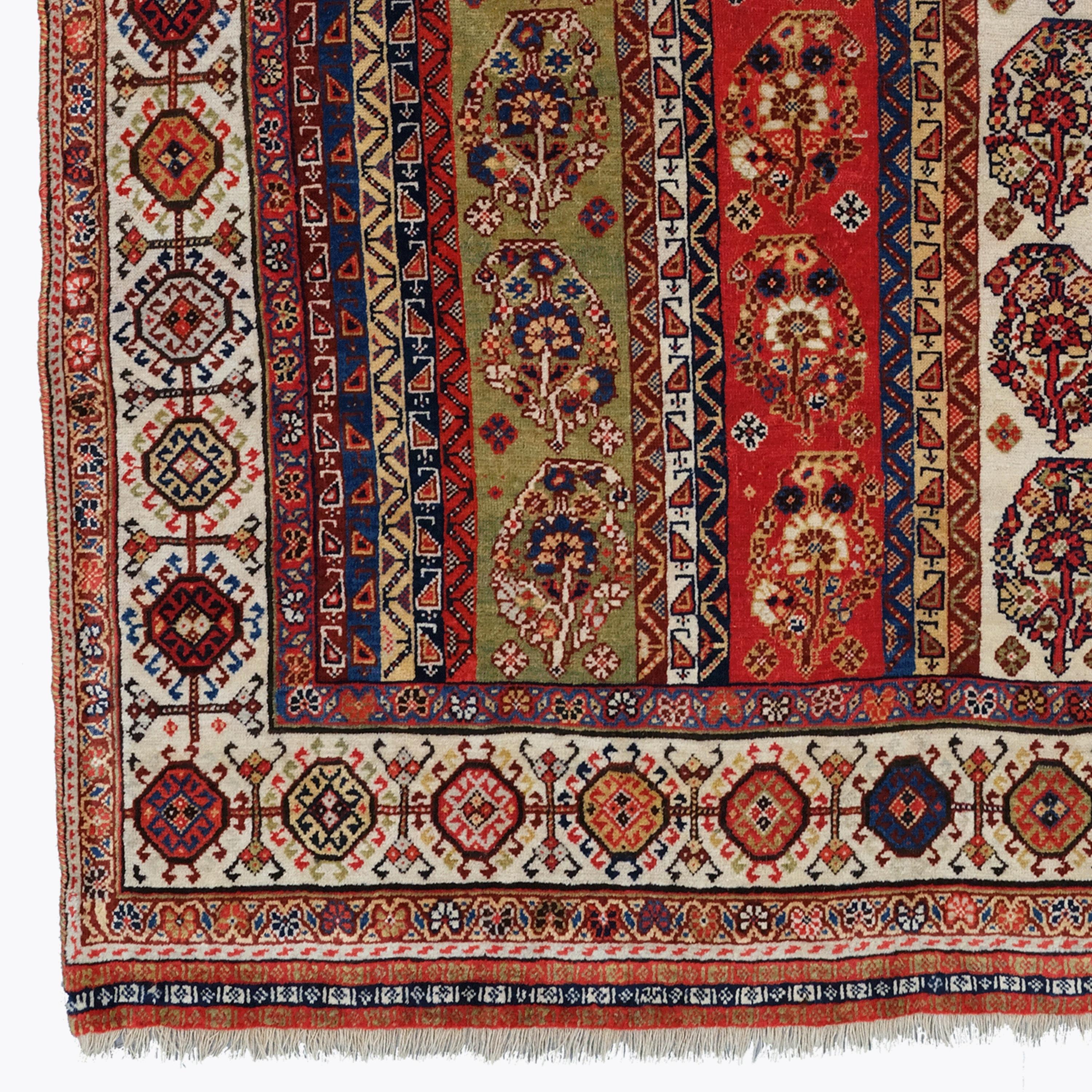 Antique Shekarlu Qashqai Rug of Scarce Striped Design
Size: 127×175 cm

This rug has a very unusual design of vertical stripes which contain a small boteh design. The array of colours is outstanding including yellows, blues, reds and greens. The