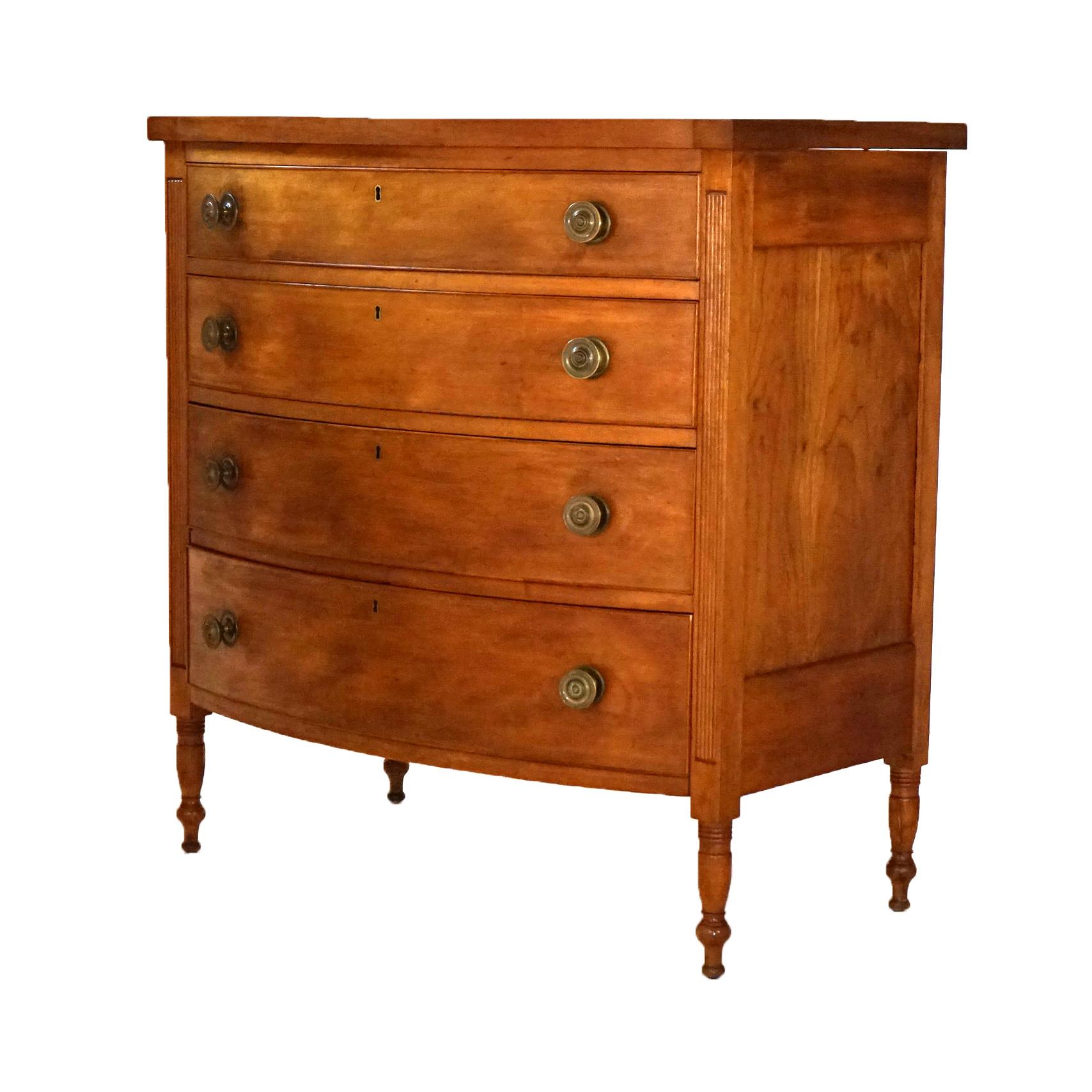 ***Ask About Reduced In-House Shipping Rates - Reliable Service & Fully Insured***
Antique Sheraton Cherry Swell Front Chest with Four Graduated Drawers and Turned Legs, Circa 1830

Measures - 42