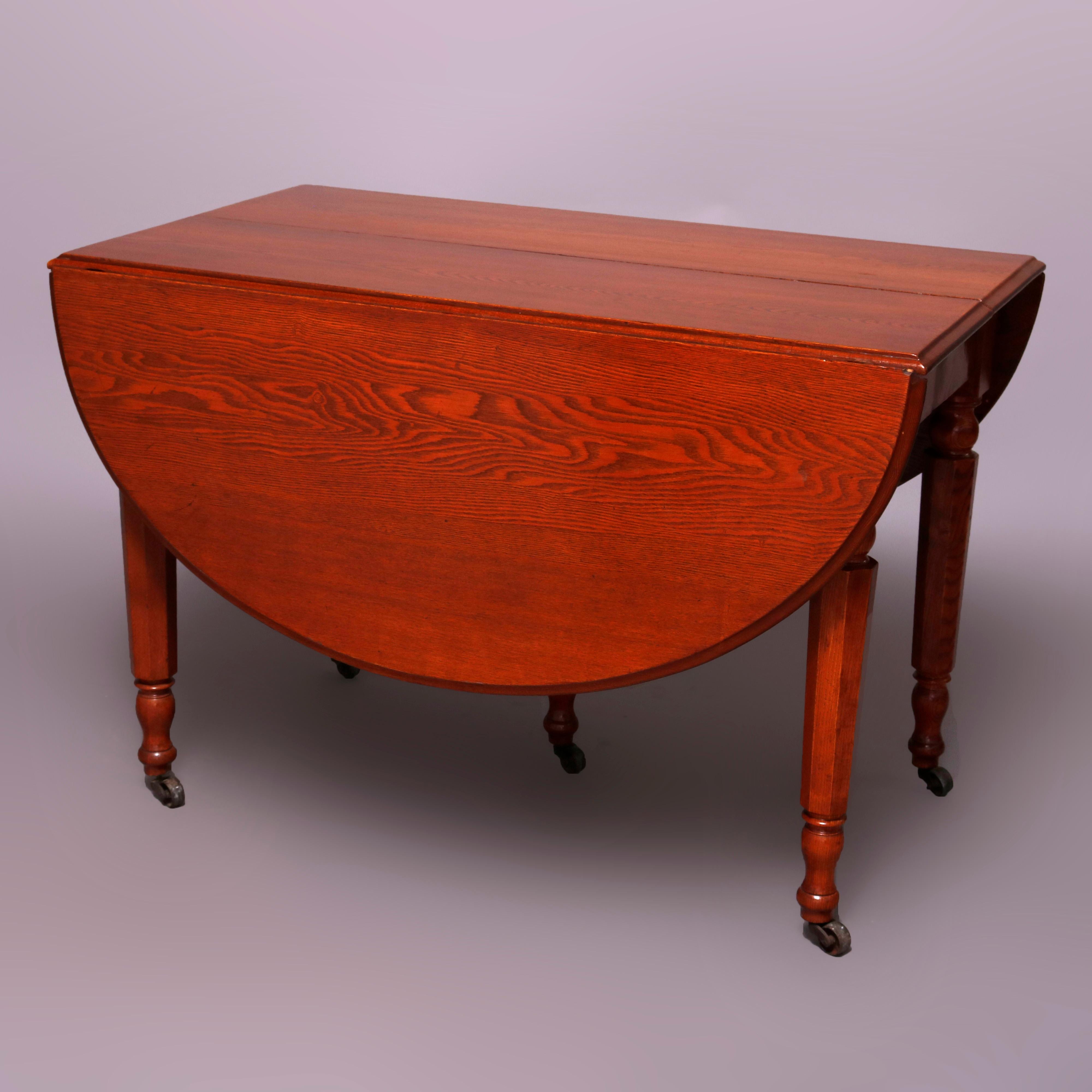 American Sheraton Chestnut Drop Leaf Banquet Dining Table with 5 Leaves, circa 1910