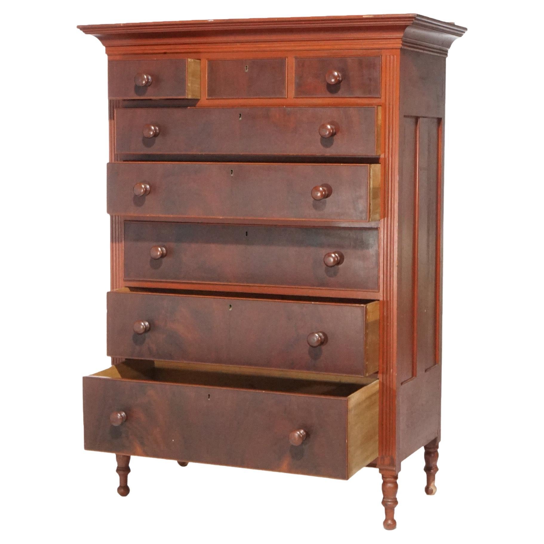 An antique Sheraton tall chest offers softwood paneled construction with faux painted drawers, raised on turned legs, c1830

Measures - 67