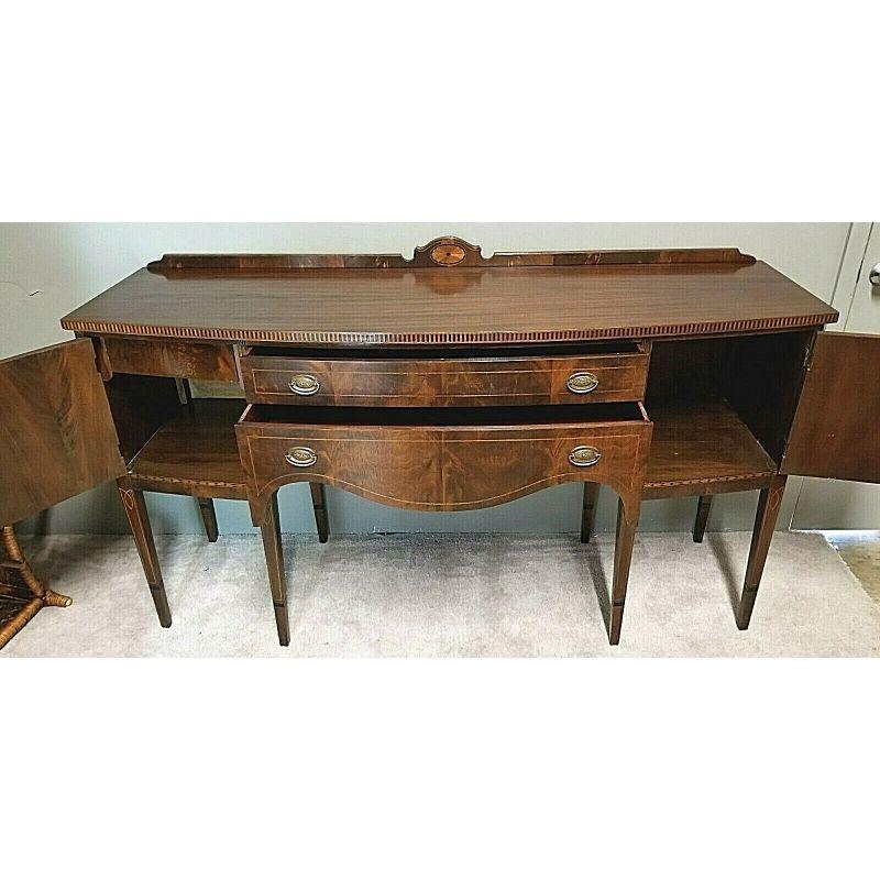 For full item description be sure to click on CONTINUE READING at the bottom of this listing.
Antique 19th Century Thomas Sheraton Federal Style Flame Mahogany and Marquetry Buffet Server Sideboard

With a larger size than many of our other high