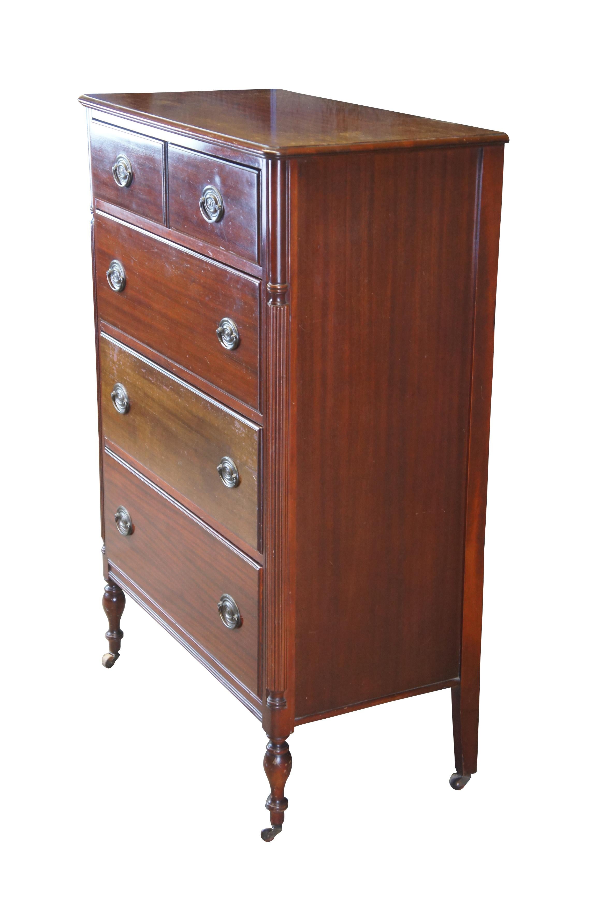 A beautiful Sheraton or Federal style tallboy dresser, circa 1930s. Made from mahogany with a 
