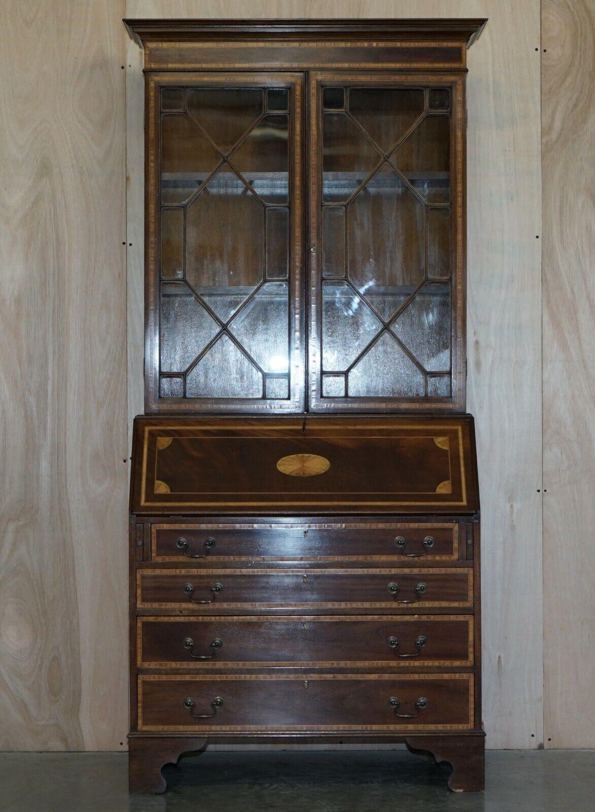 Royal House Antiques

Royal House Antiques is delighted to offer for sale this exquisite Sheraton Revival Walnut, Mahogany & Satinwood Bureau bookcase with brown leather drop front desk

Please note the delivery fee listed is just a guide, it covers