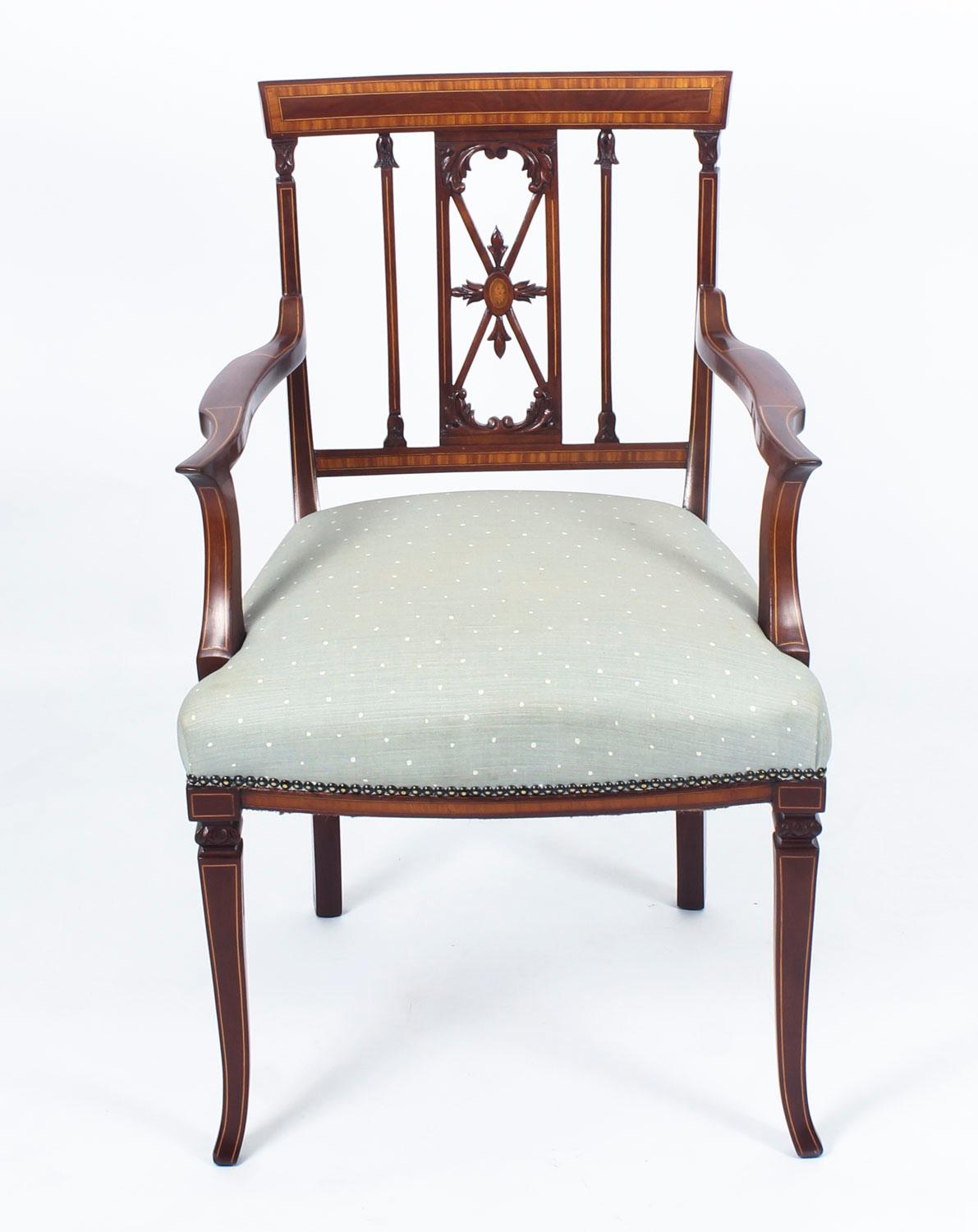 This is a beautiful antique Sheraton Revival mahogany armchair, circa 1880 in date.

With satinwood crossbanding and stringing and decorative pierced leaf carved splat. It has outward scrolled arms on shaped supports, an overstuffed bowed seat in a