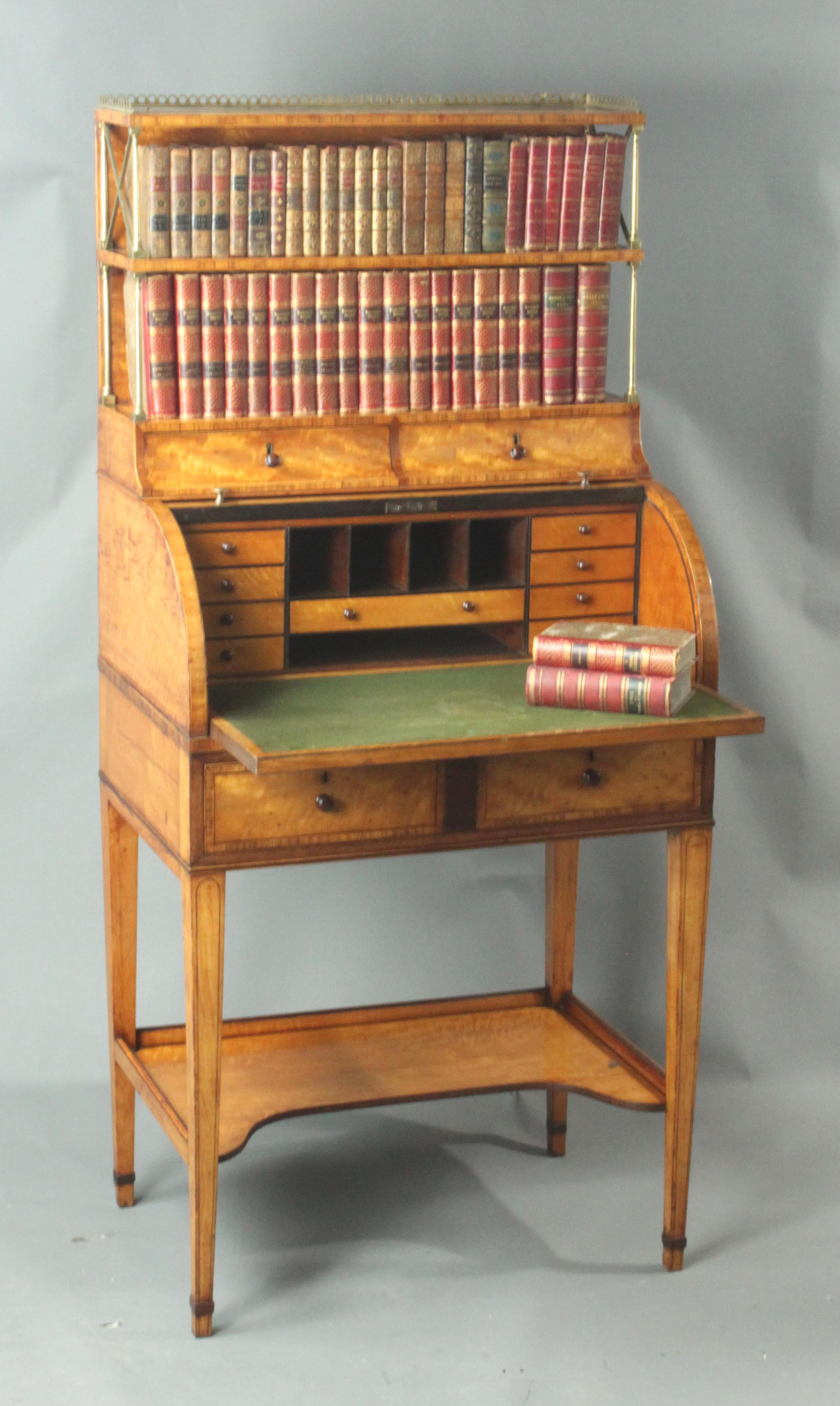 Antique satinwood cylinder bookcase
A fine George III Sheraton period satinwood cylinder bookcase; good original colour and patina with kingwood cross-banding, boxwood and ebony stringing and purple heart inlay; with a very pleasing satinwood colour.