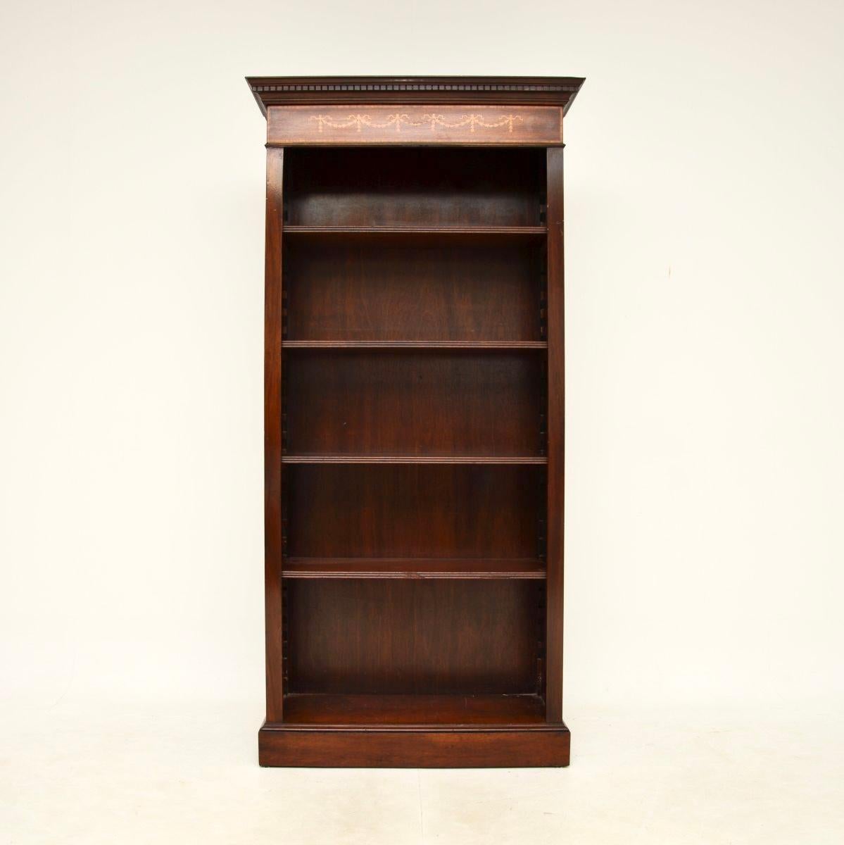 A smart and very well made antique open bookcase. This was made in England, it dates from around the 1950’s.

It is of superb quality and is a very useful size with lots of storage space. The shelves sit on shark tooth supports and are all removable